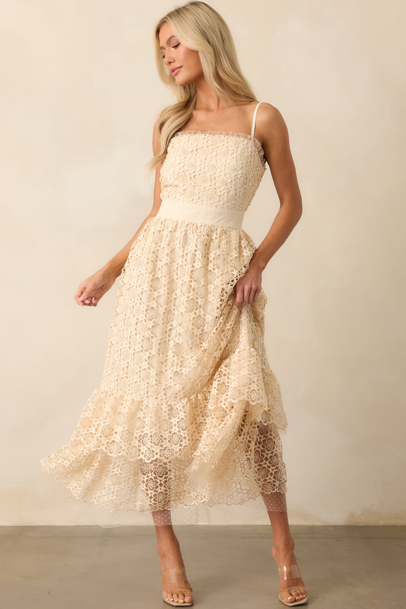 A complete outfit view of the tiered midi dress with a cinched lace waist and spaghetti straps, styled to show overall fit.