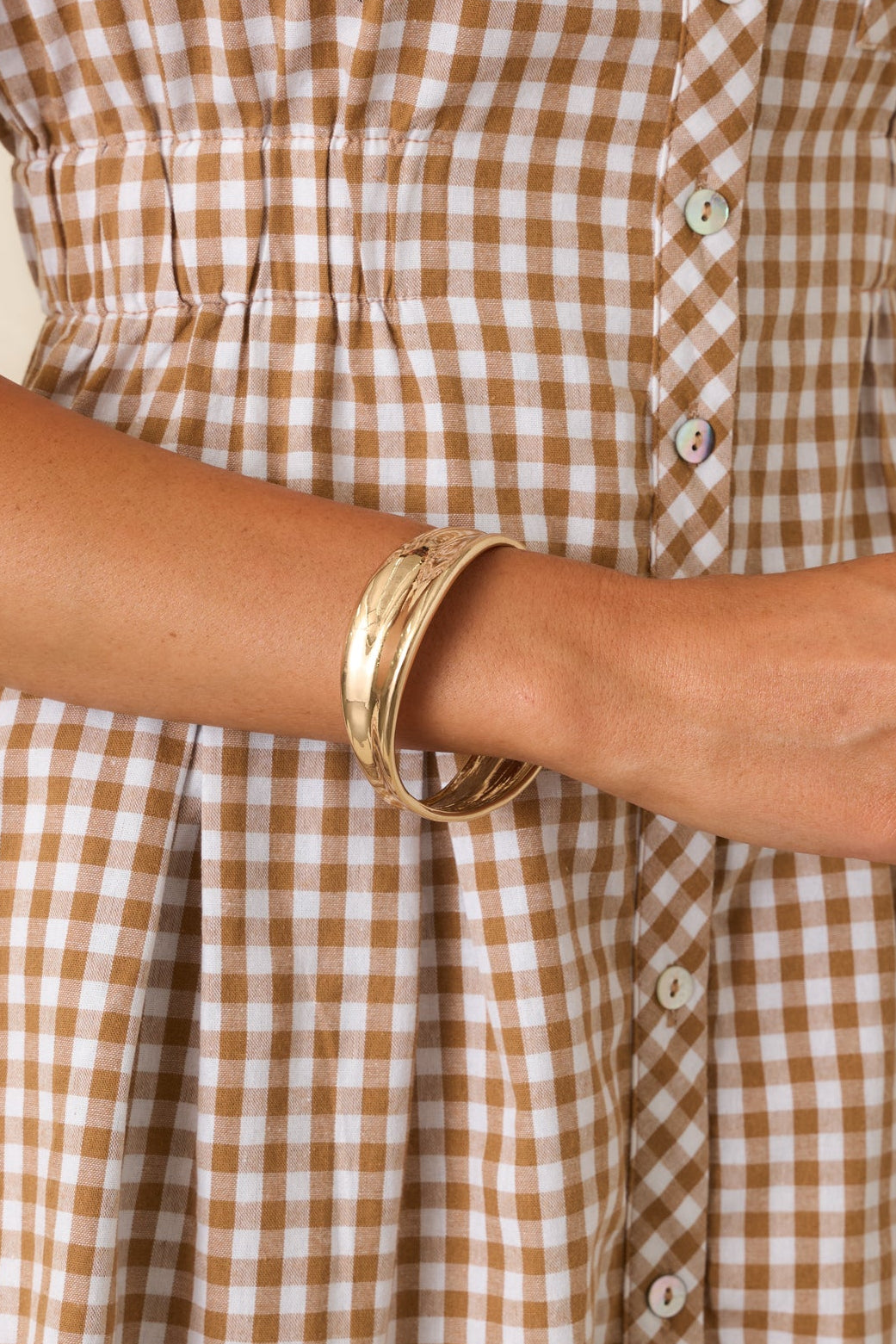 Contemporary statement bracelet showcasing fluid curves, dimensional sections, and an elevated timeless design.