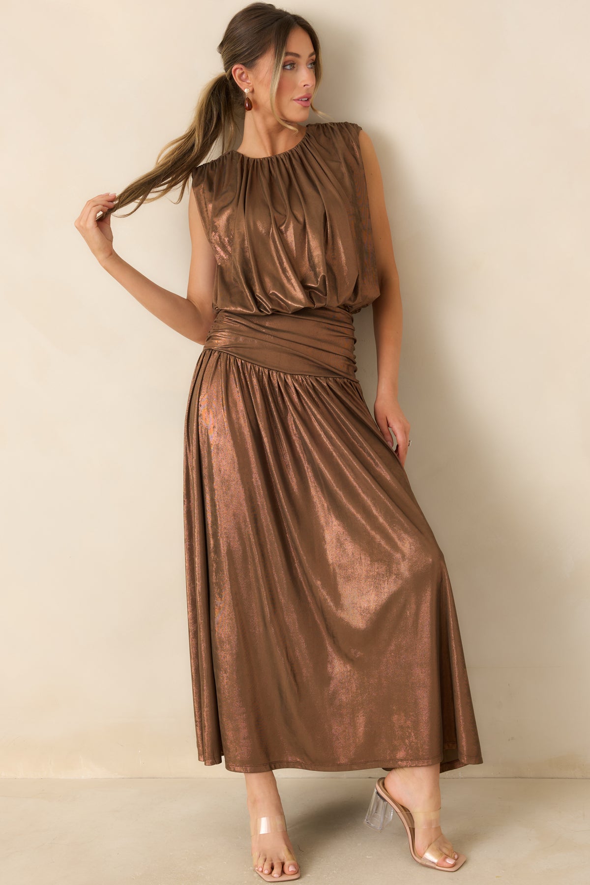 Coppery bronze sleeveless top with a rounded neckline and a softly shaped bubble silhouette.