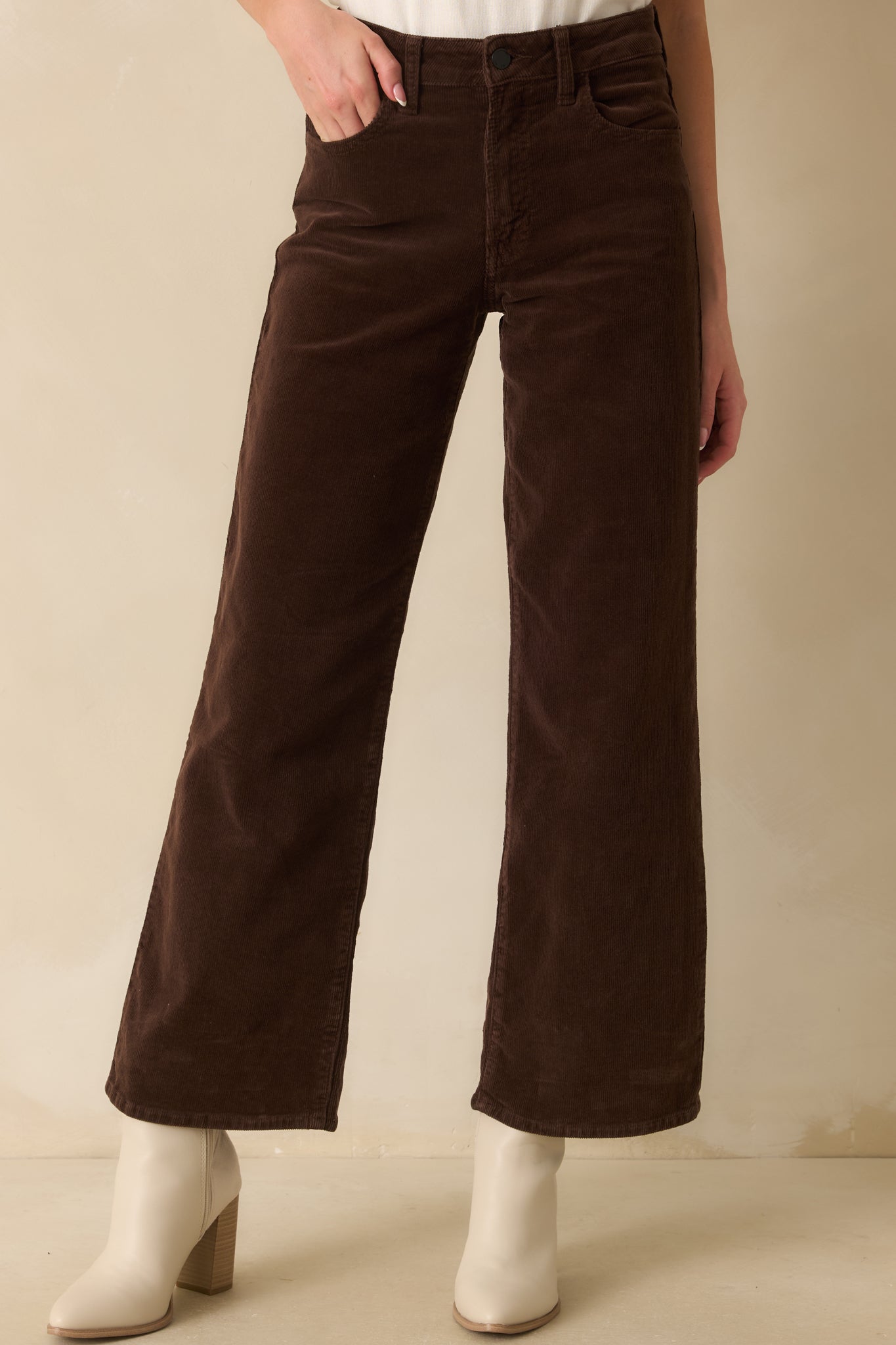 Cropped front view showing the corduroy texture and smooth fit through the hips and thighs.