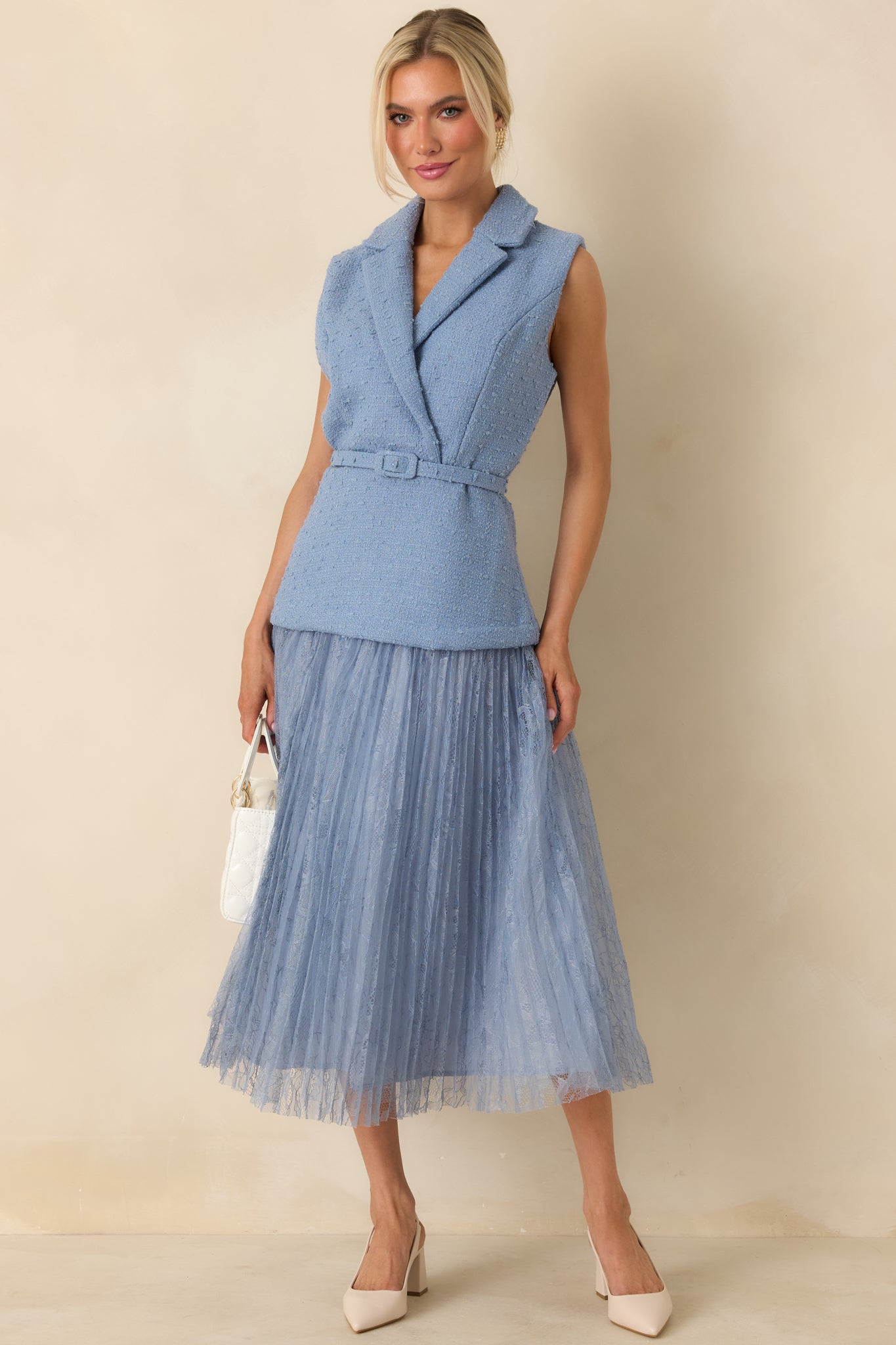 Cornflower blue sleeveless midi dress with a tweed-inspired woven bodice and a notched collar neckline.
