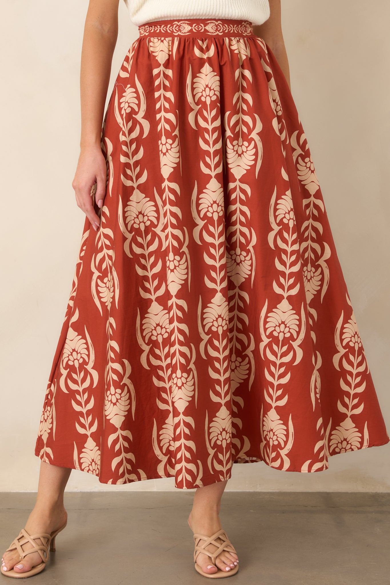 The skirt's 100% cotton construction creates a soft texture and fluid A-line silhouette with comfortable movement.
