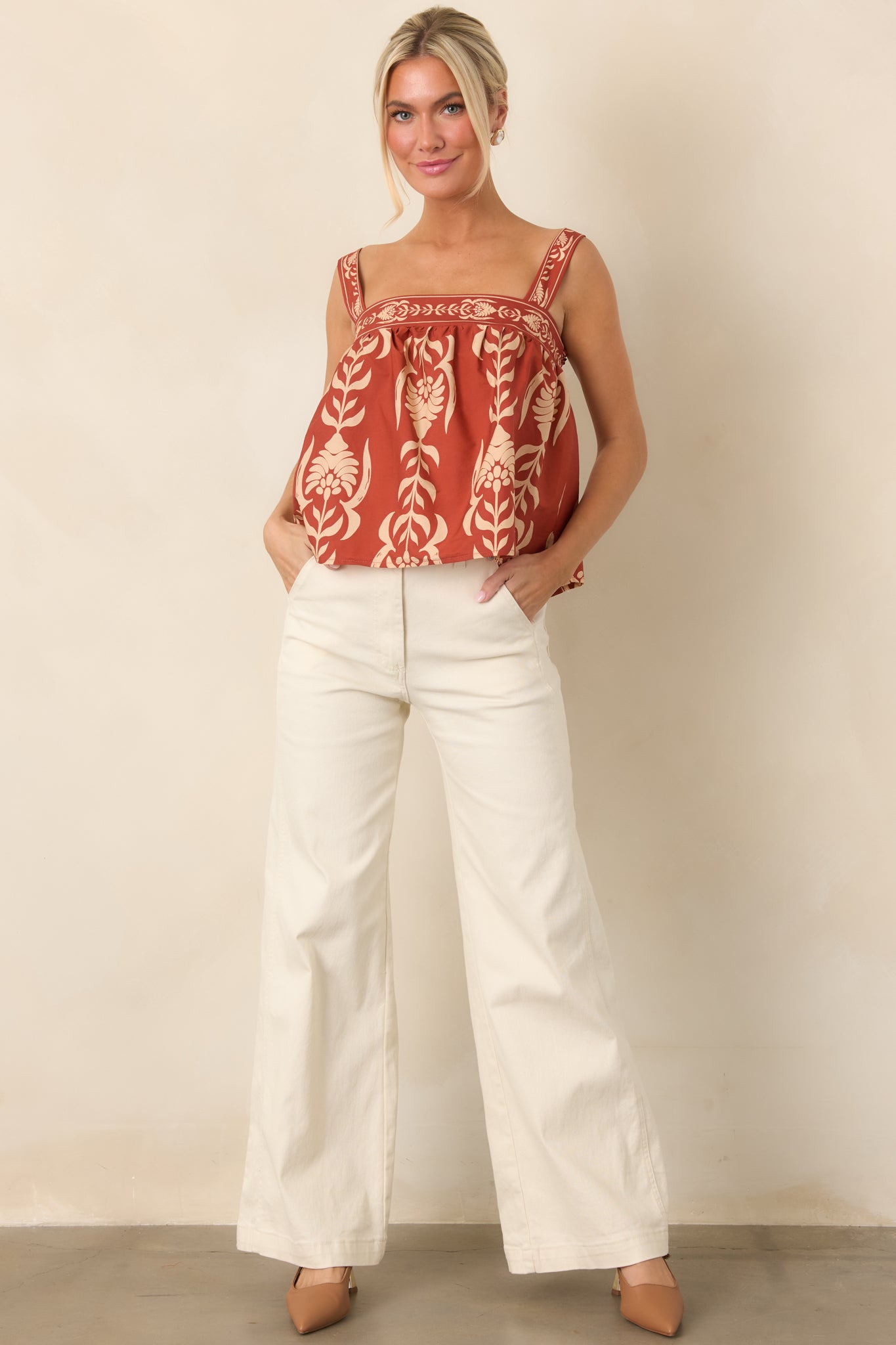 Feminine cotton babydoll top with a clean square neckline, wide straps, and gathered detailing that creates gentle volume.