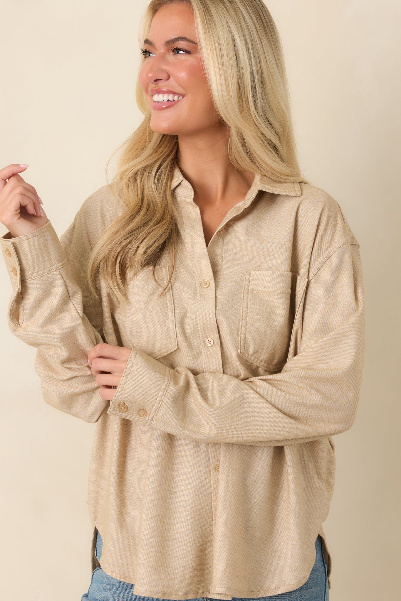 Cotton-blend top showcasing the smooth fabric, relaxed silhouette, and classic button-front design.