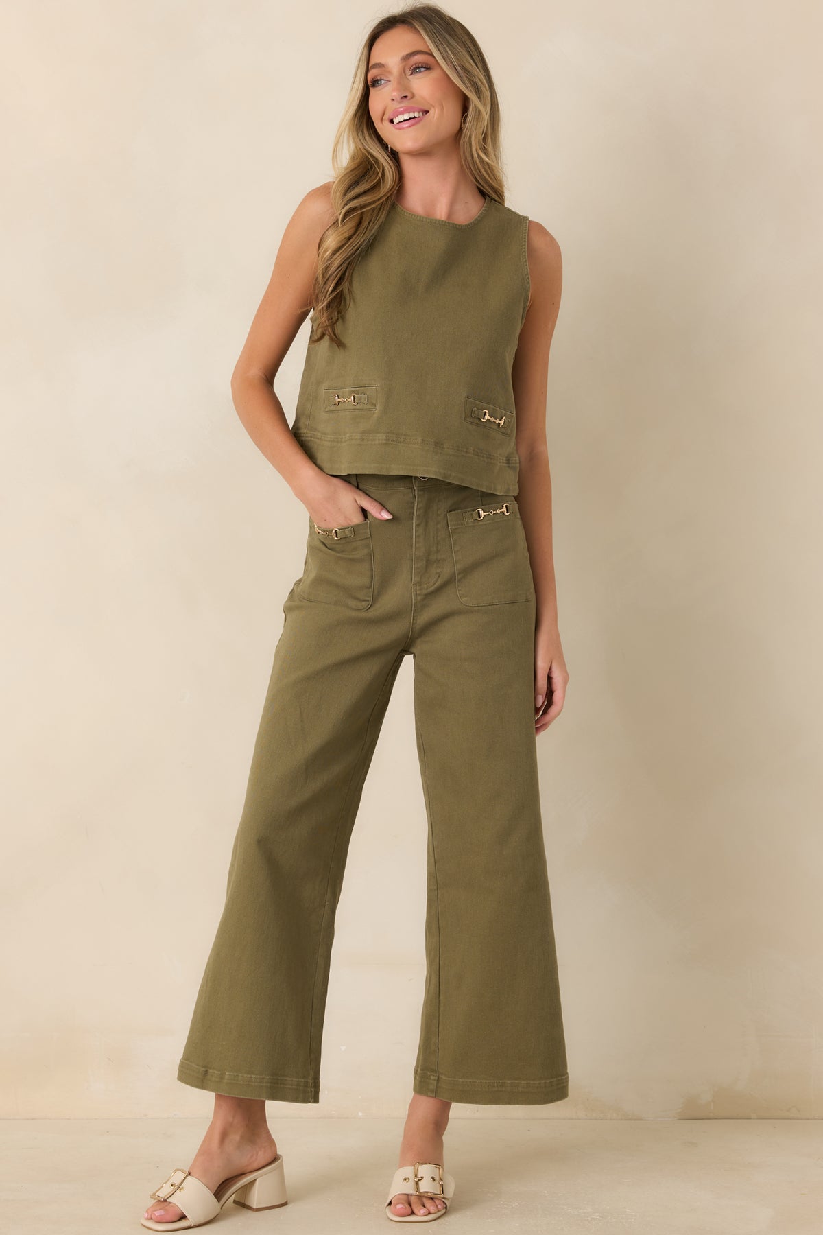 Cotton-blend denim pants with a wide leg silhouette, belt loops, and a classic zip-and-button closure.