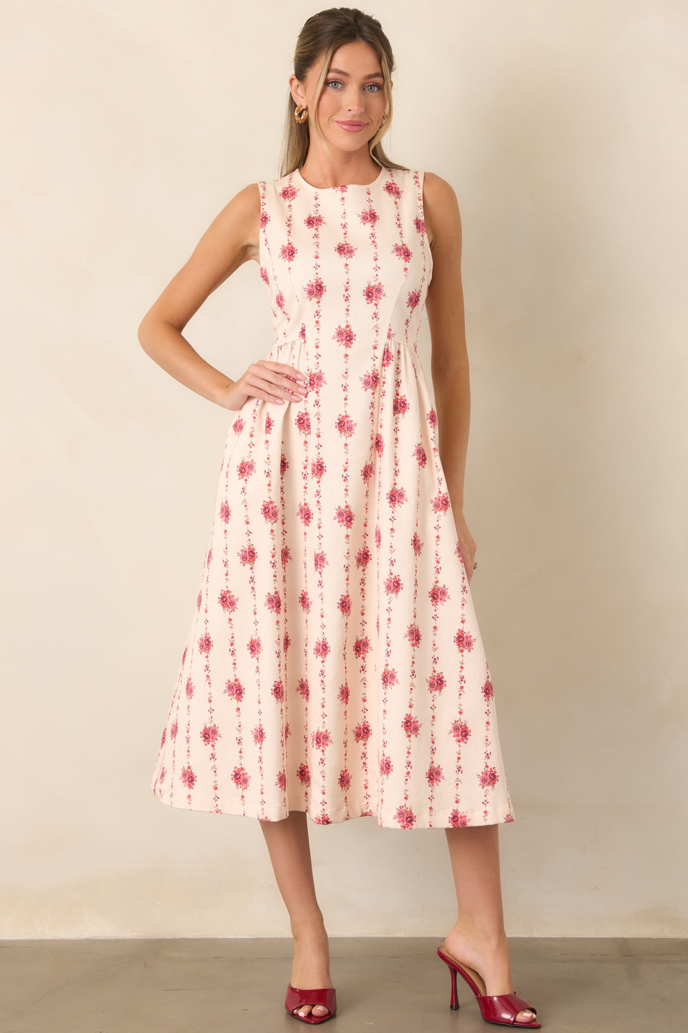 Structured cotton-blend midi dress showcasing delicate vertical floral stripes, a defined bodice, and softly flared skirt.