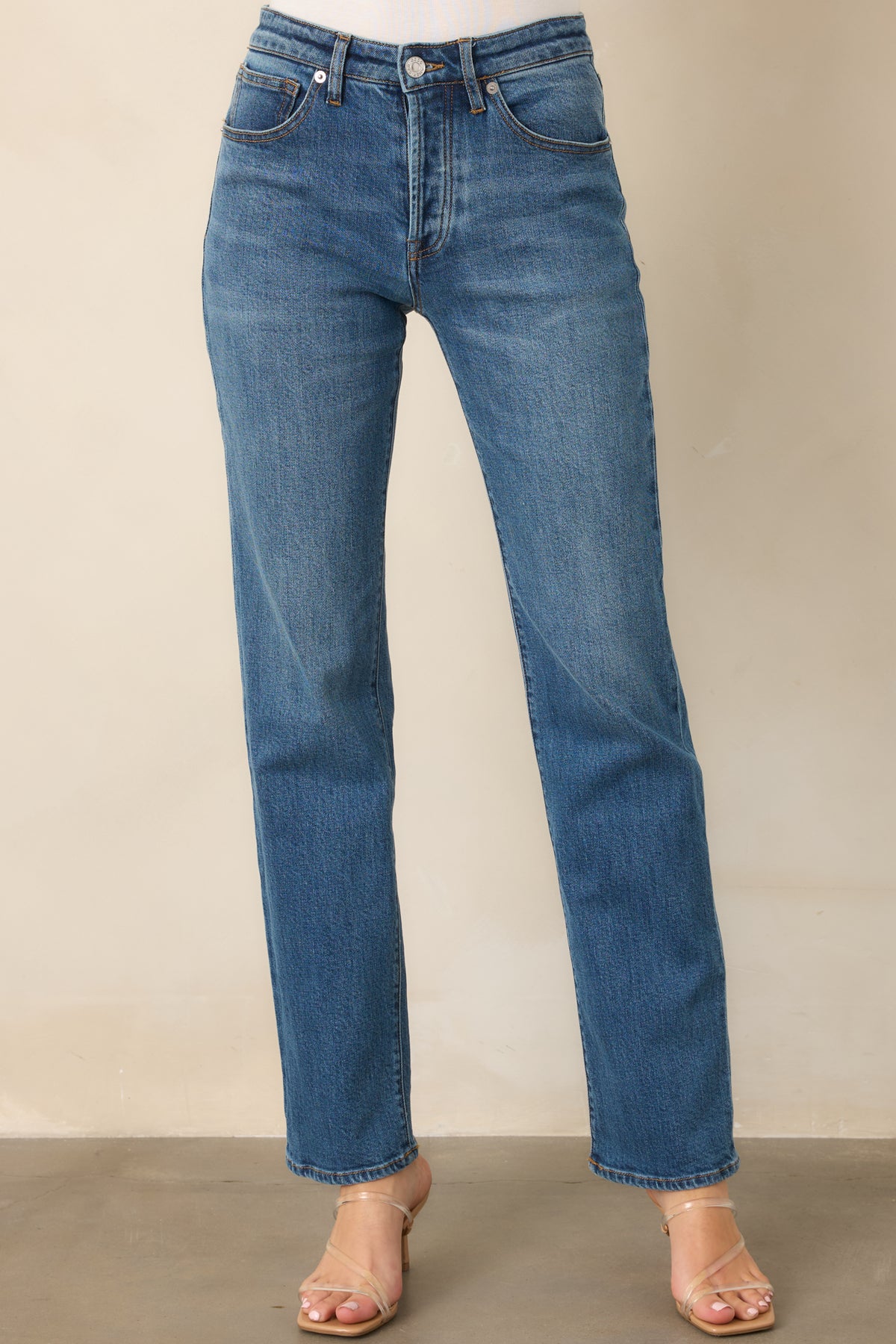 Cotton blend jeans featuring vintage-inspired whiskering and a straight-leg shape.
