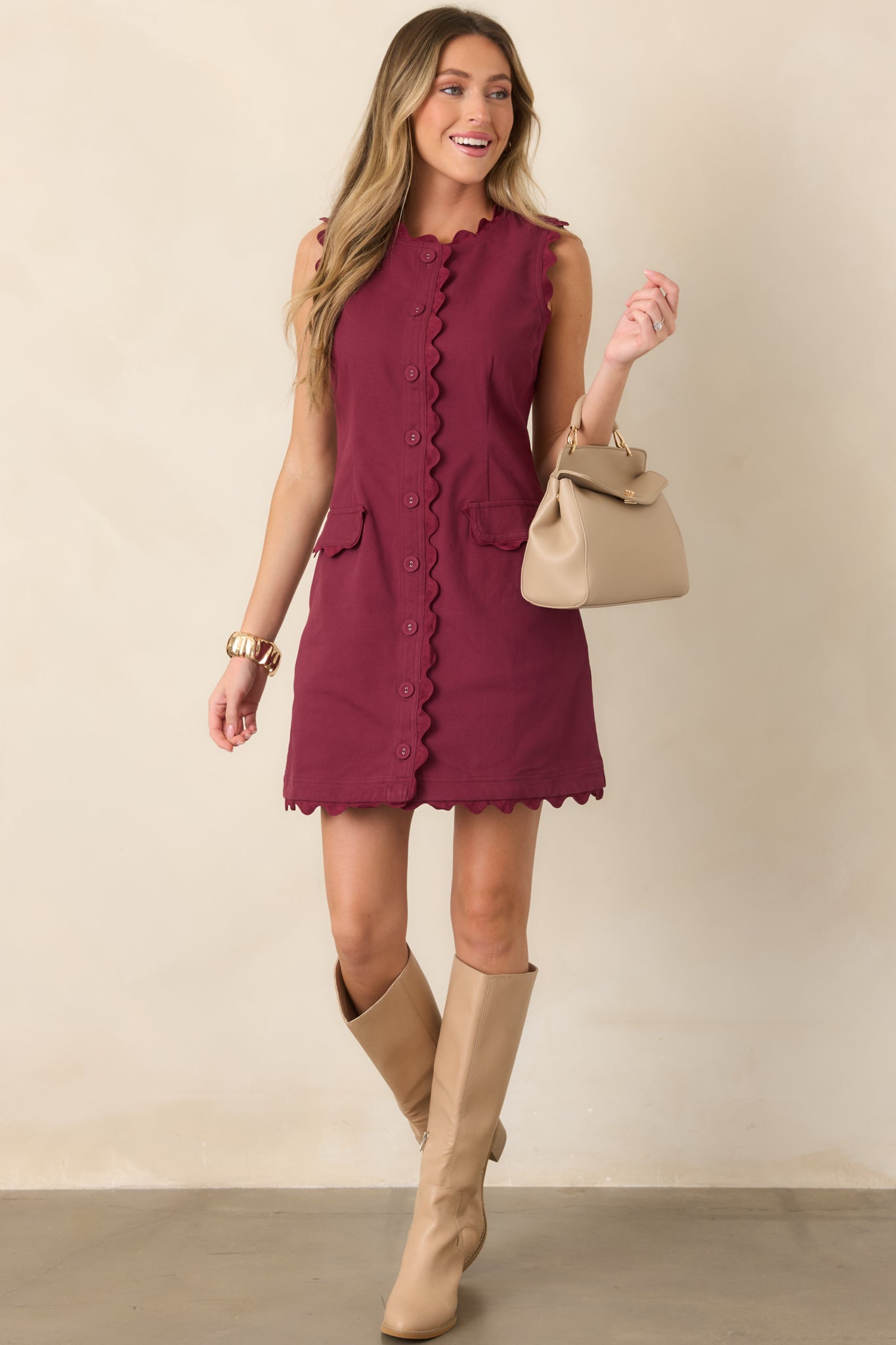 Structured cotton-blend mini dress featuring a flattering waist, decorative ric rac trim, button front, and petite flap pockets.