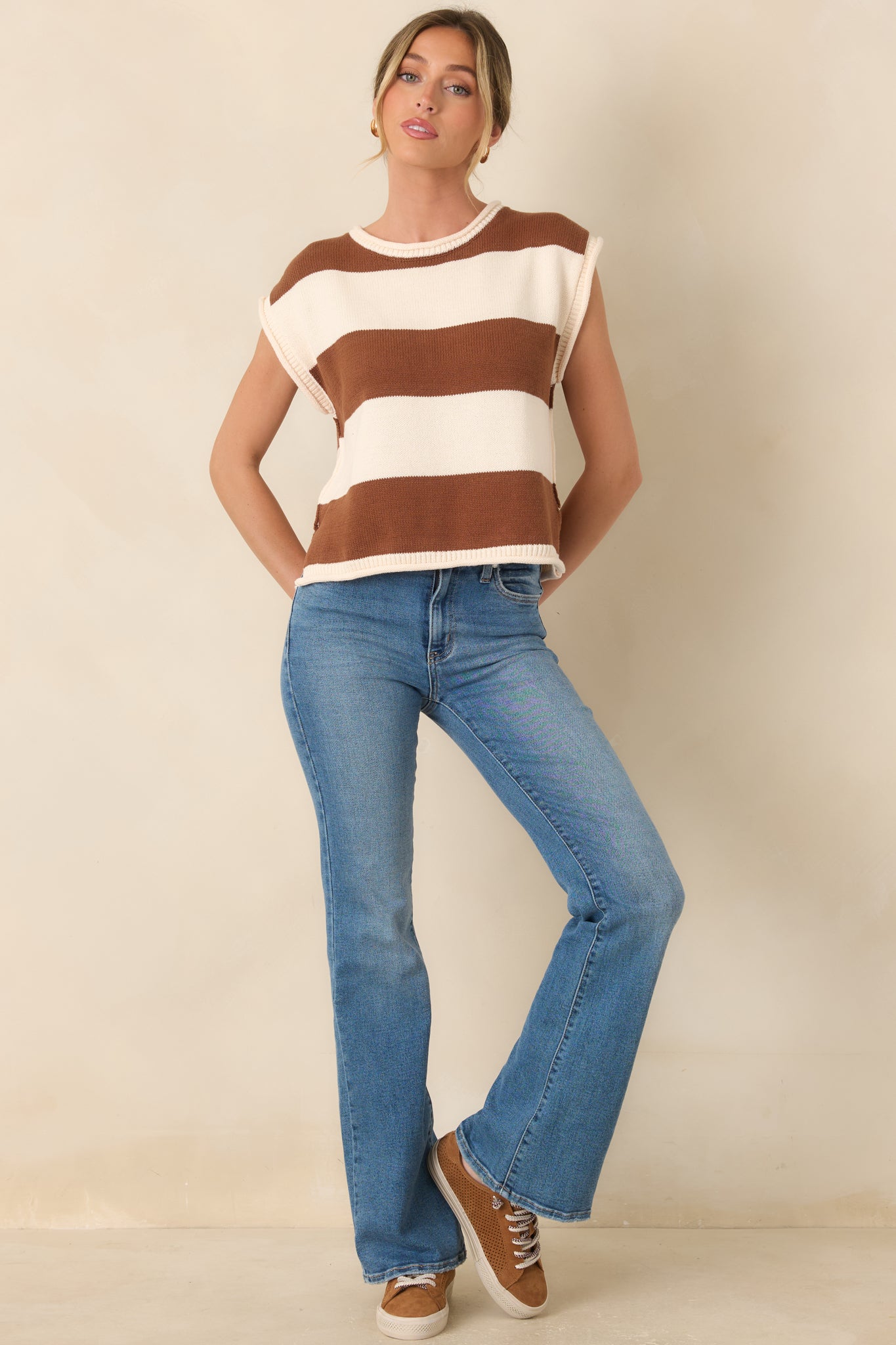 Casual cotton-blend top with horizontal striping, a simple crew neckline, and softly structured cap sleeves in a breathable lightweight knit.