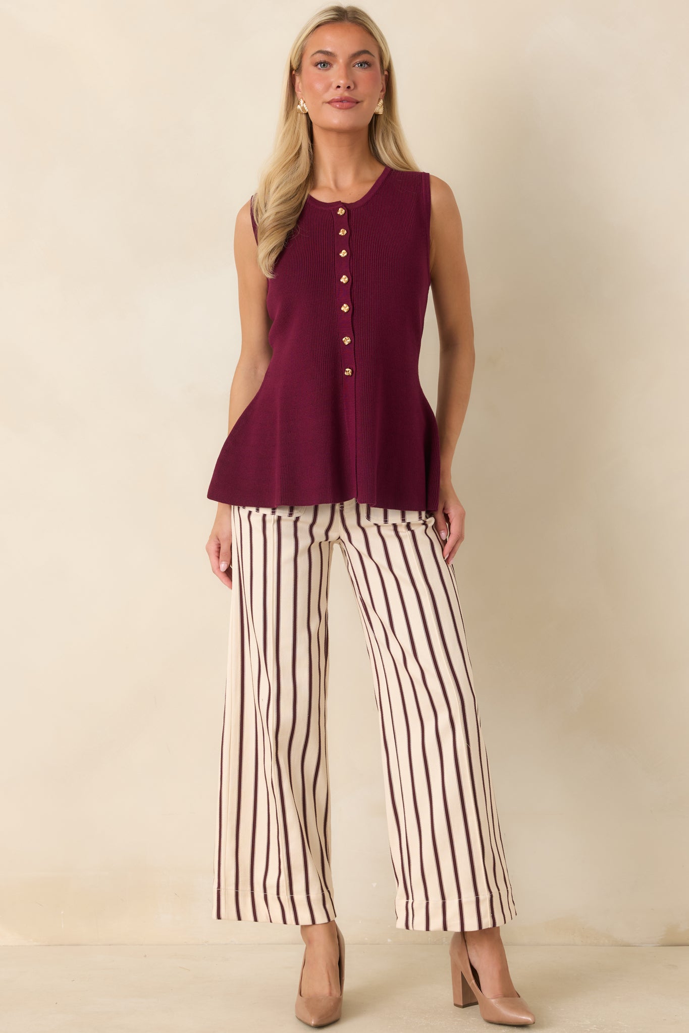 Cotton blend pants with vertical stripes, a comfortable stretch fit, high-rise waist, and utility-inspired front pocket detailing.