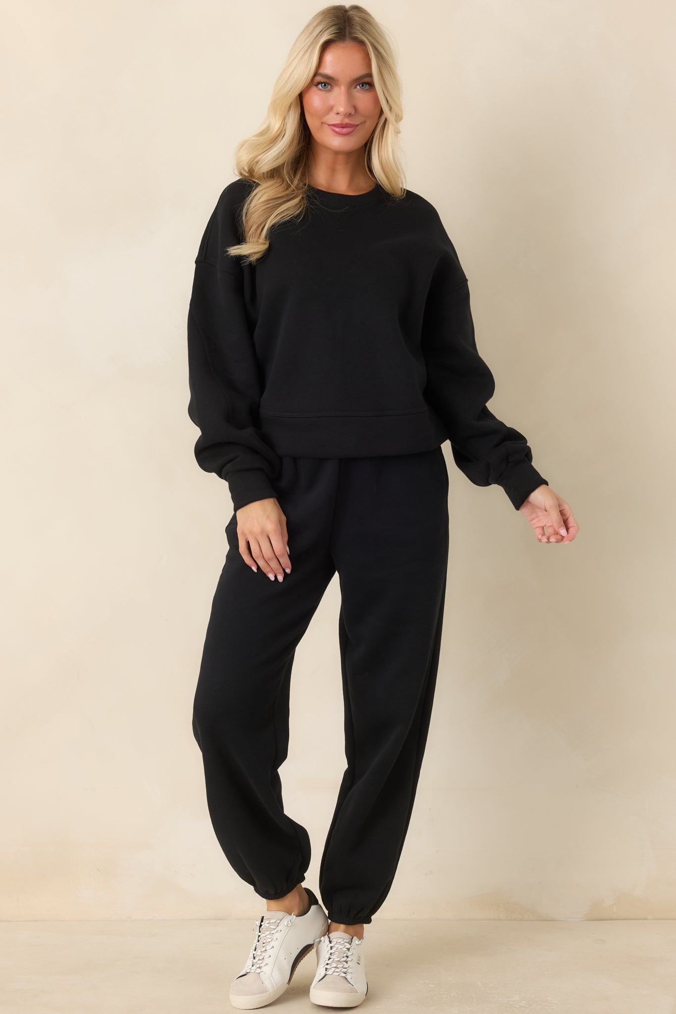 Cotton-blend sweatshirt featuring a classic crew neckline, fitted sleeve cuffs, banded hem, and clean cropped shape.