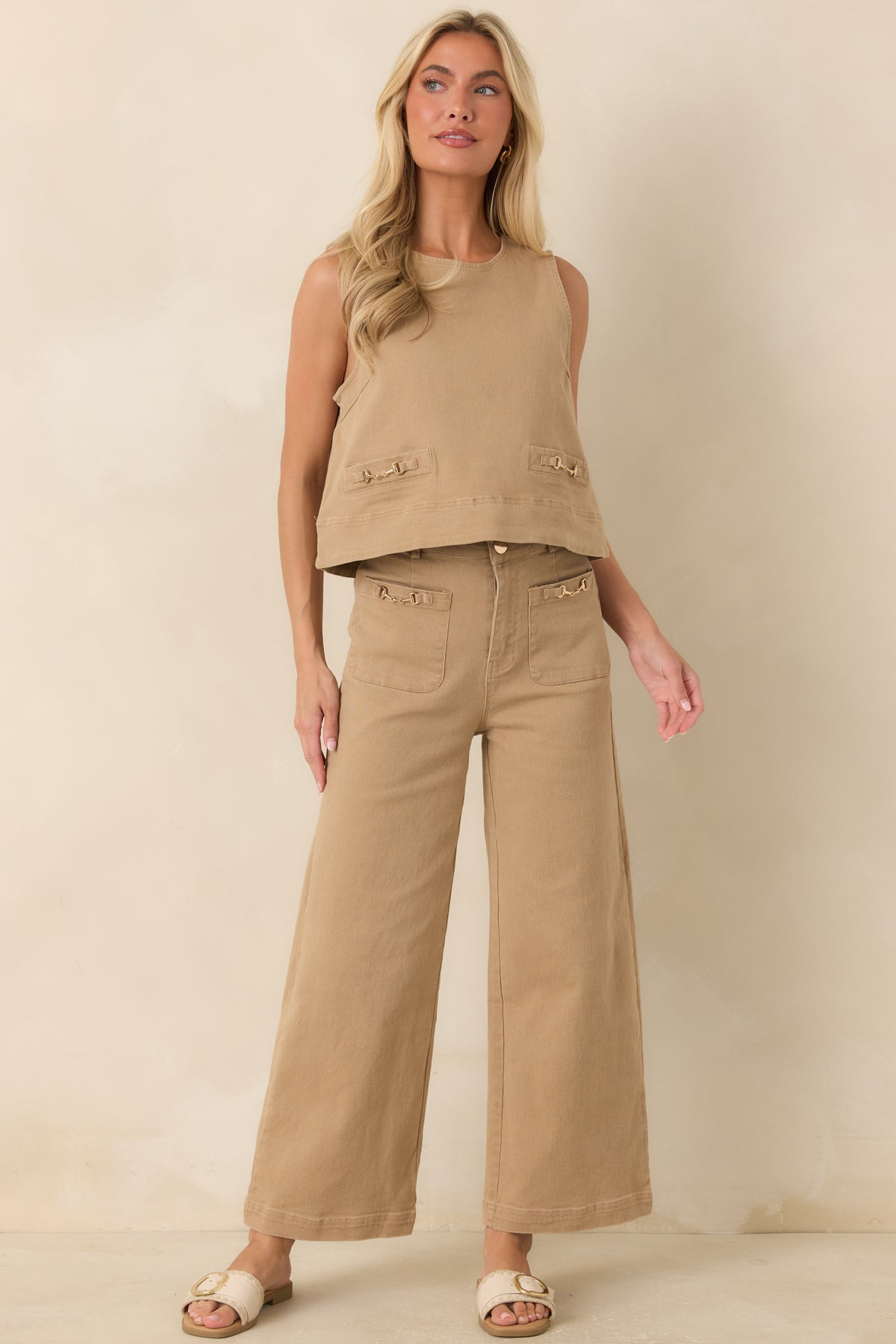 Cotton-blend top designed with a slightly cropped hem, decorative front welt details, and a concealed back zipper.