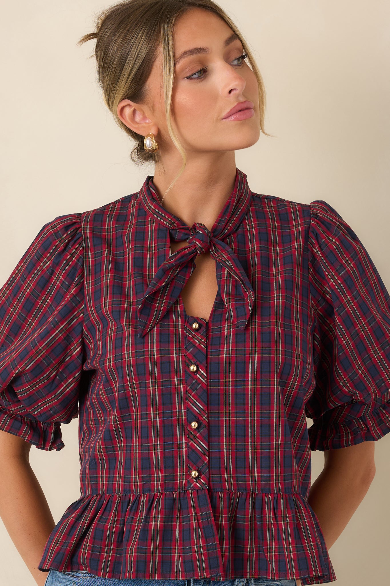 The front of this cotton blouse highlights the self-tie neckline and gold-tone button detailing.