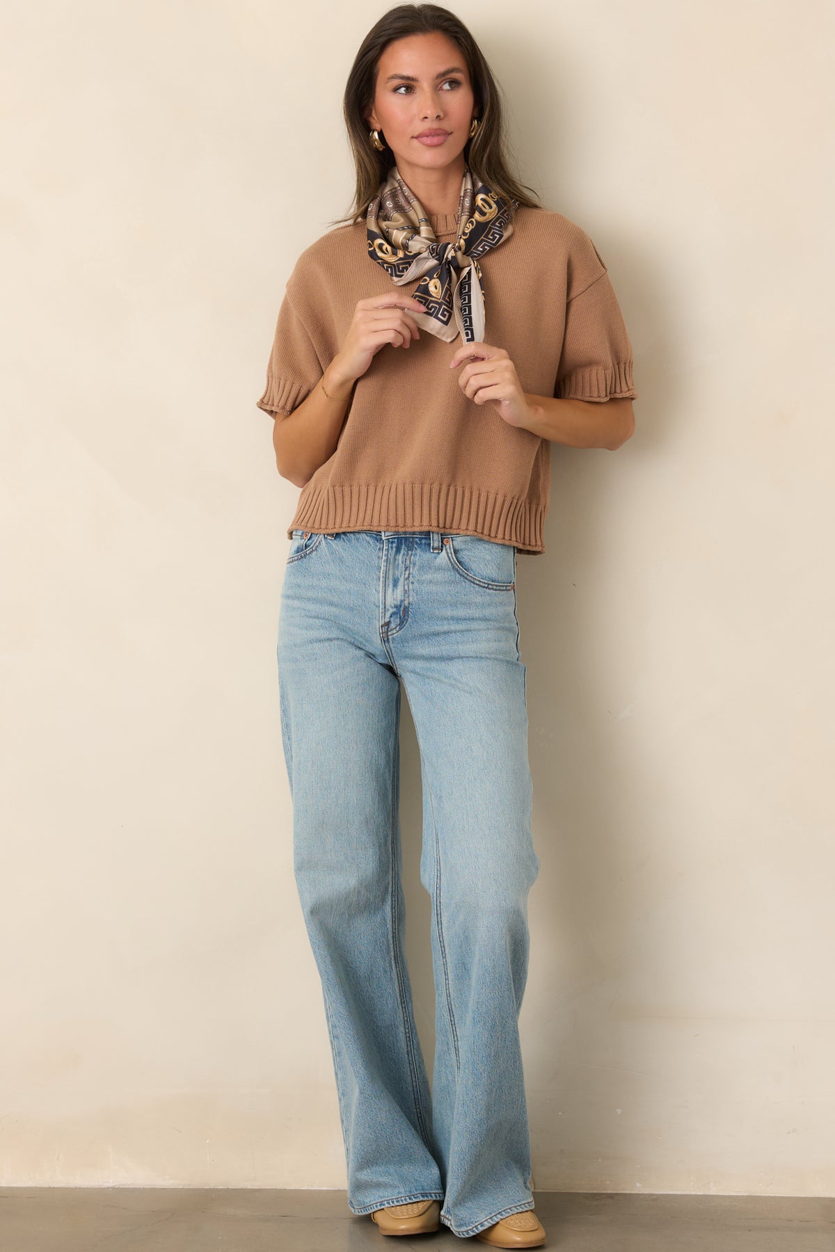 100% cotton top showcasing a laid-back boxy shape with ribbed neckline, cuffs, and hem.