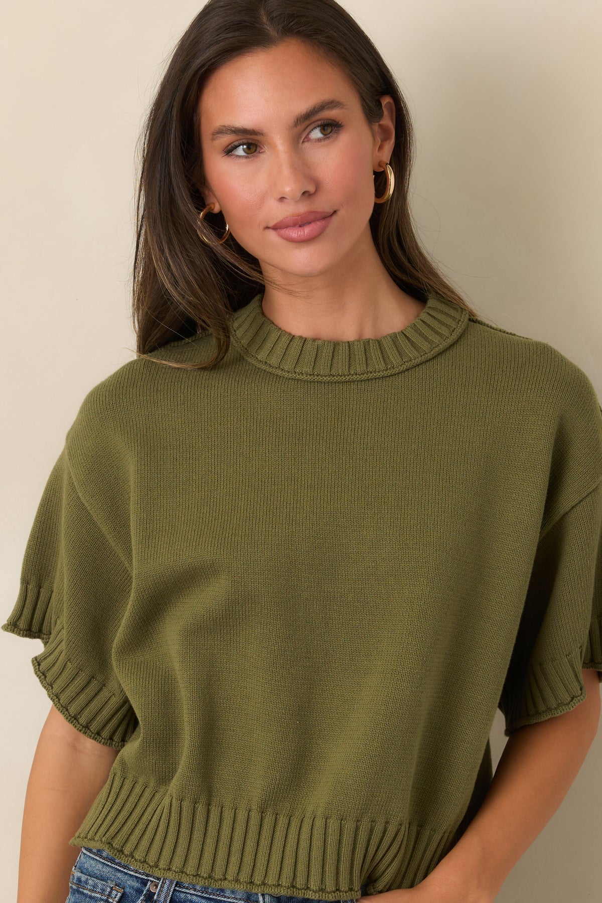 100% cotton top showcasing its slightly boxy silhouette and relaxed short sleeves.