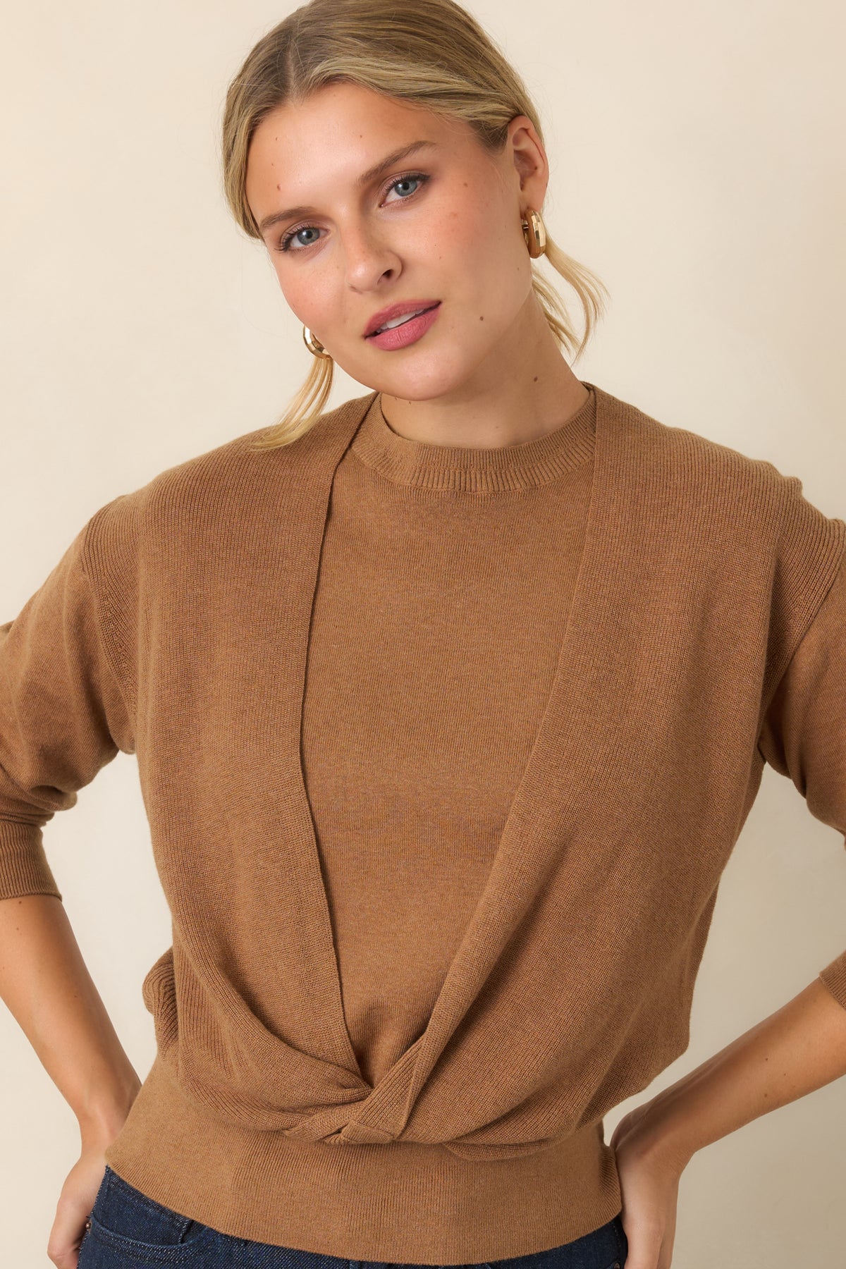 Cotton-and-cashmere top highlighting the coordinating knit layers and refined crew neckline.