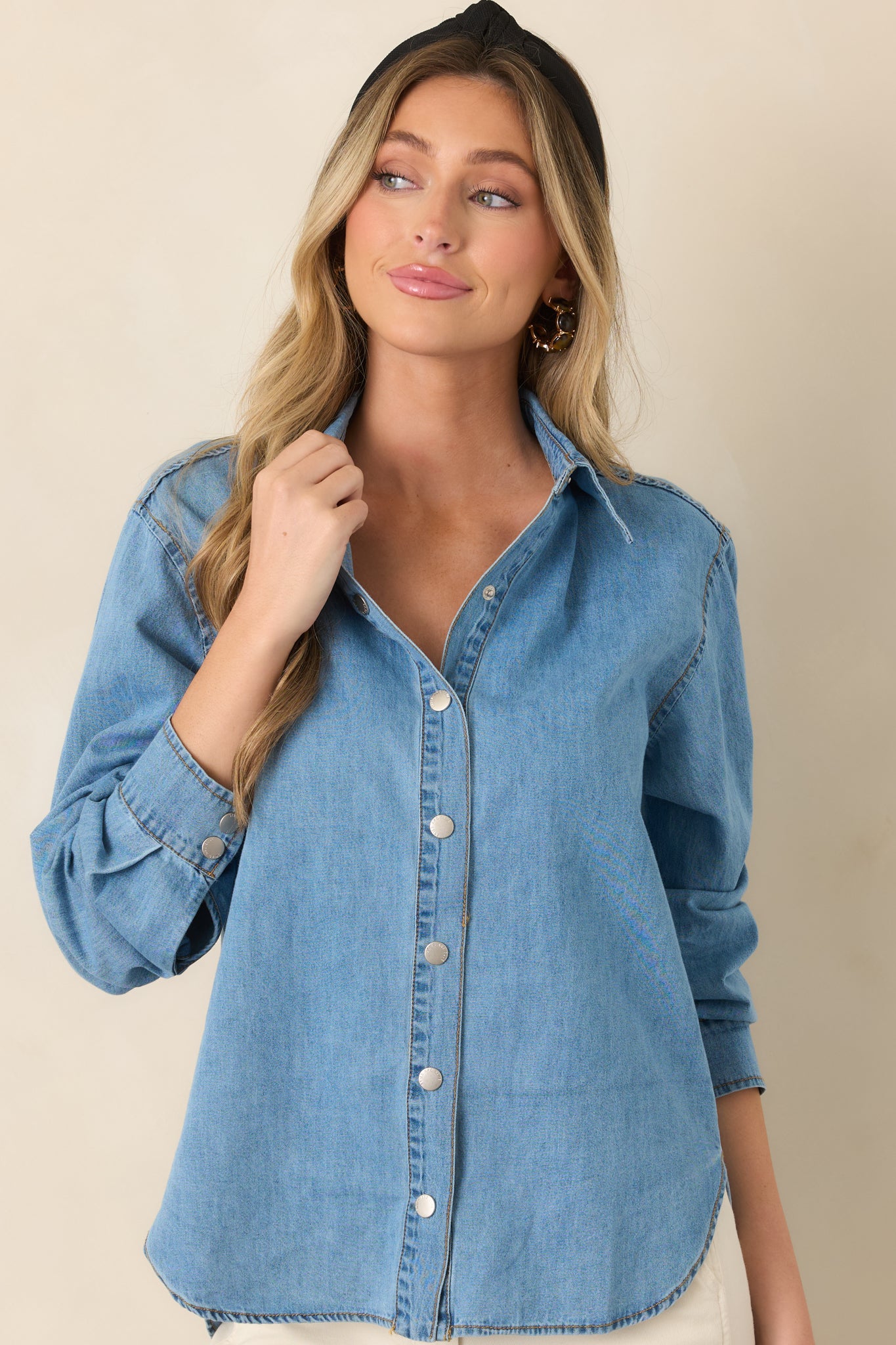 Cotton top featuring a structured collar, gold-tone button details, relaxed shoulders, and practical roll-tab sleeve styling.