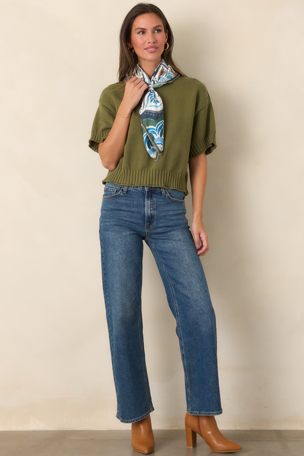100% cotton top with a crew neckline, relaxed short sleeves, chunky ribbed trim, and a slightly boxy silhouette.