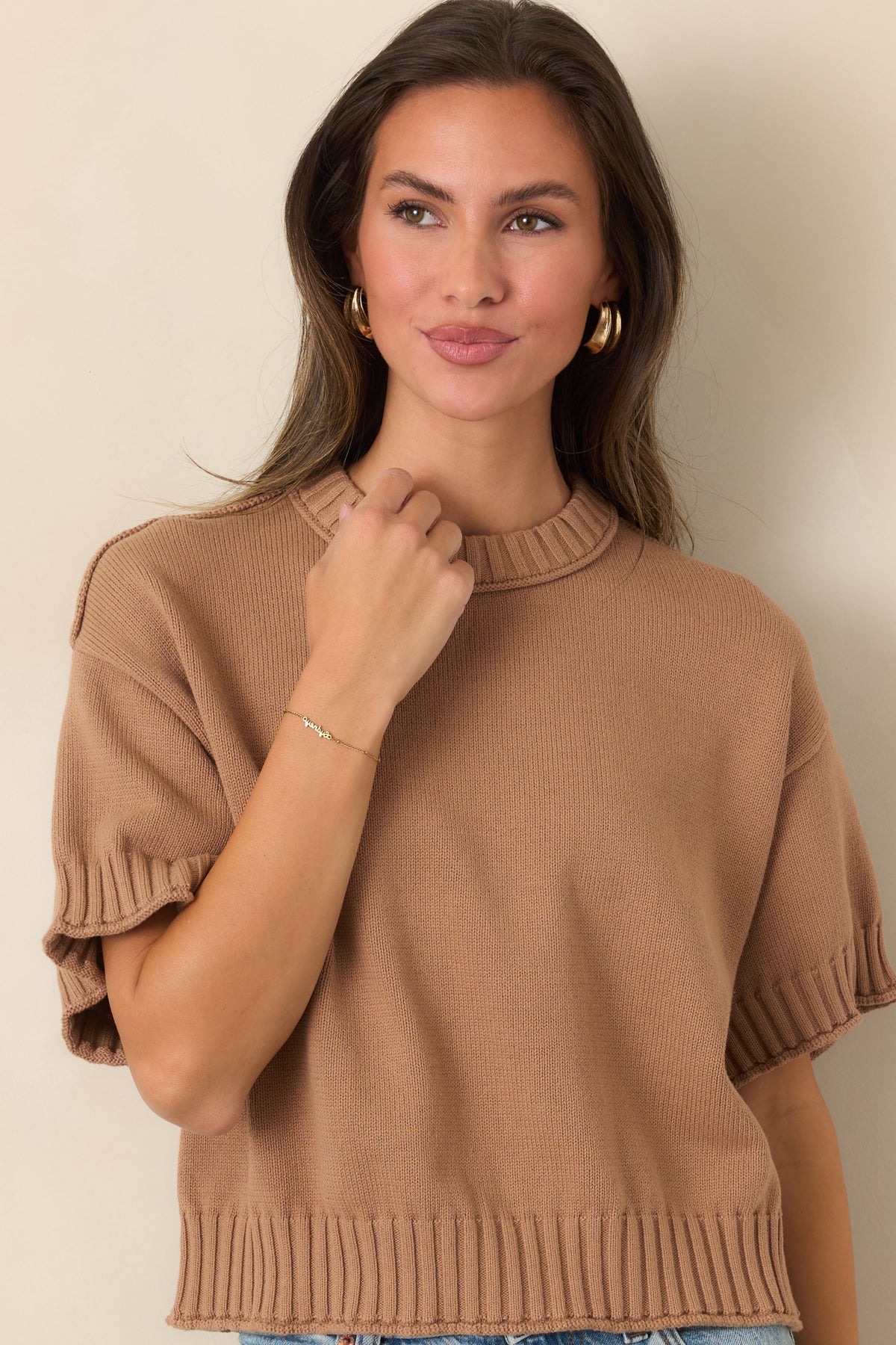 Crew-neck cotton top with chunky ribbed trim defining the neckline and short sleeve cuffs.