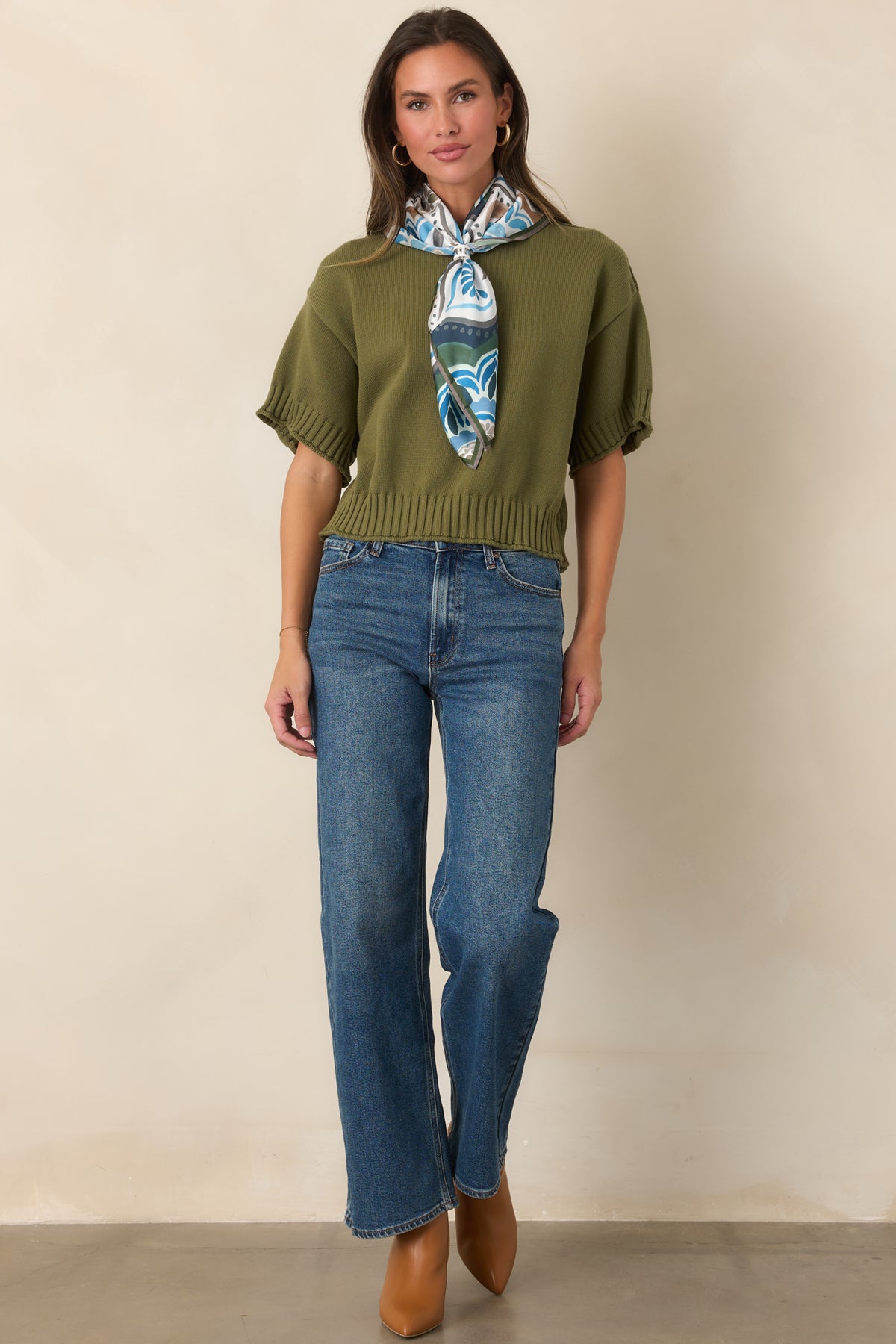Cotton top featuring a classic crew neckline, short sleeves, and ribbed trim along the neckline and hem.
