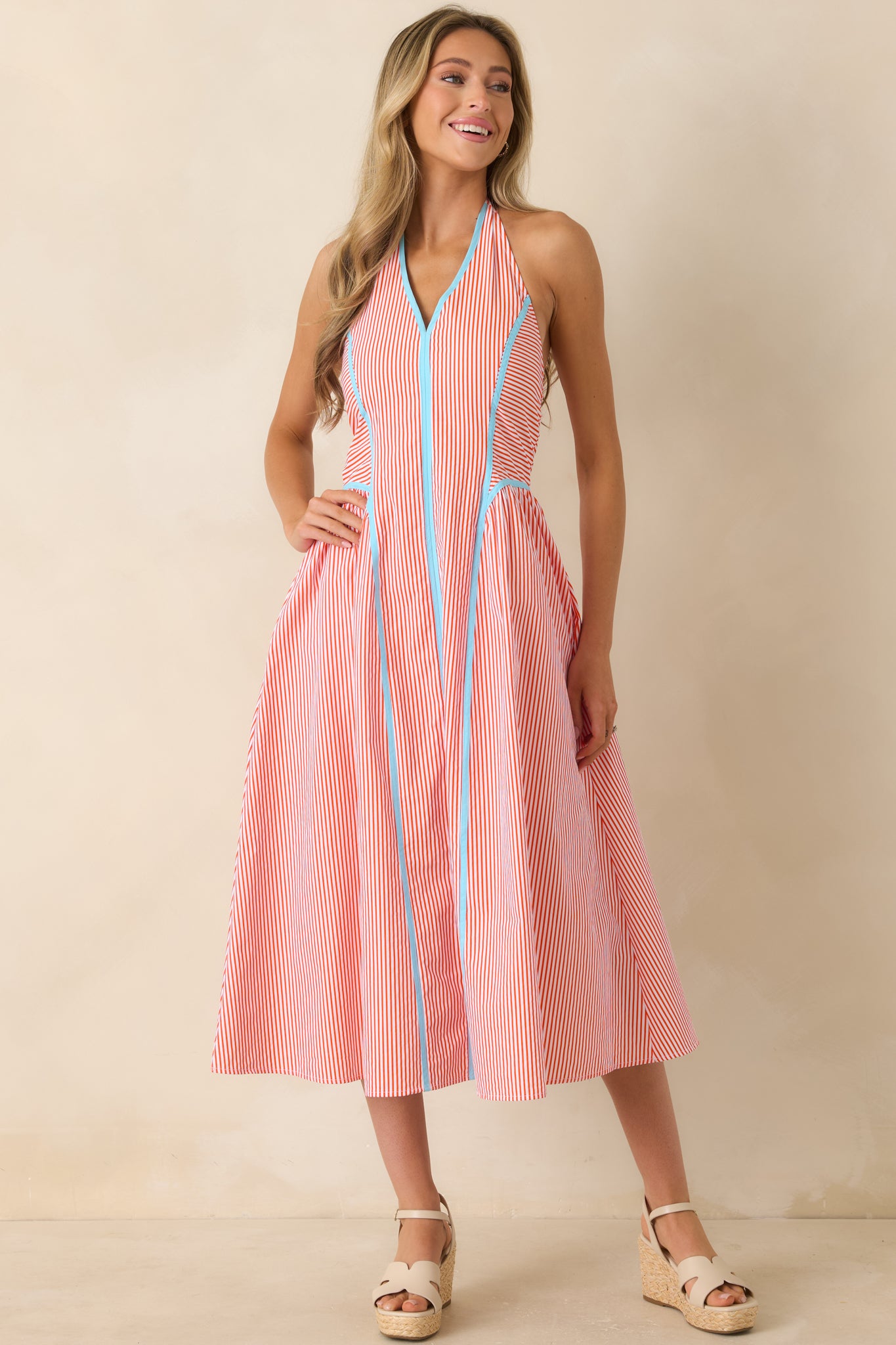 Fully lined cotton dress highlighting the feminine midi length, structured bodice, and comfortable fit.