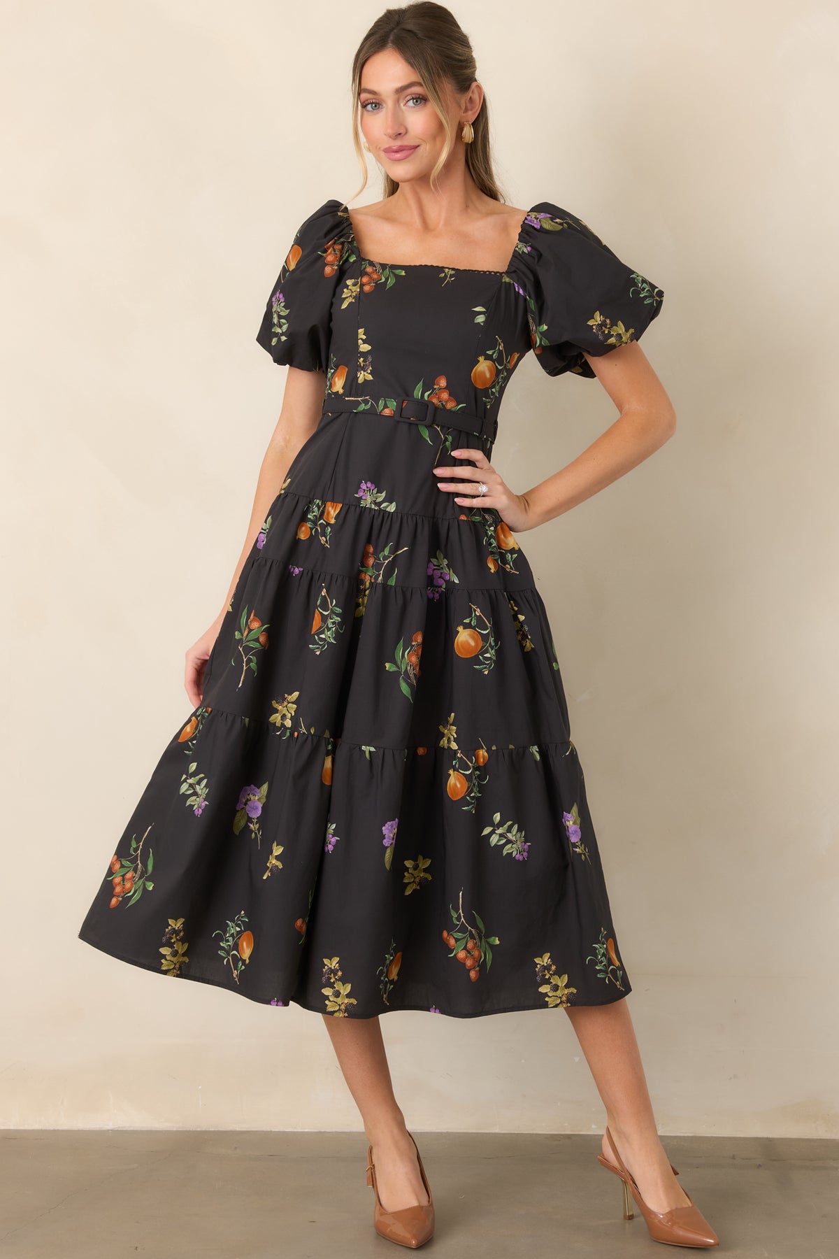 Cotton dress featuring a square neckline with delicate trim, dramatic puff sleeves, a coordinating waist belt, and a fitted bodice.