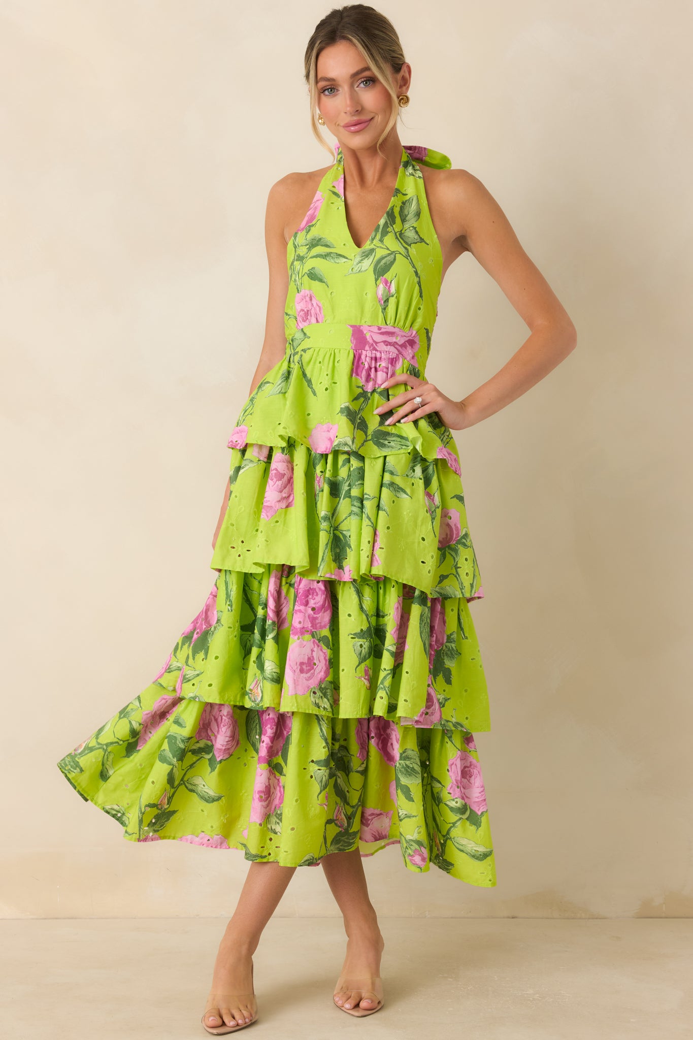 Cotton eyelet midi dress featuring a halter neckline, tiered ruffle skirt, and fit-and-flare silhouette.