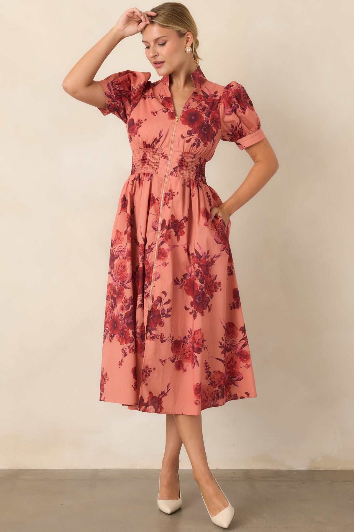 Cotton floral midi dress showcasing the softly gathered waist and flowing A-line skirt.