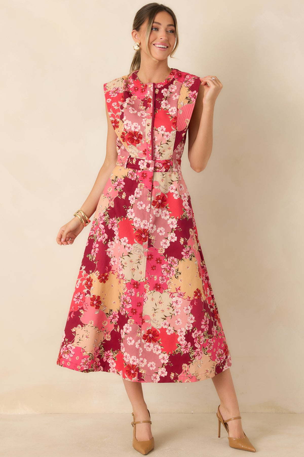 Cotton midi dress with delicate multicolor flowers, stitched shoulder panels, and a gently flared skirt.