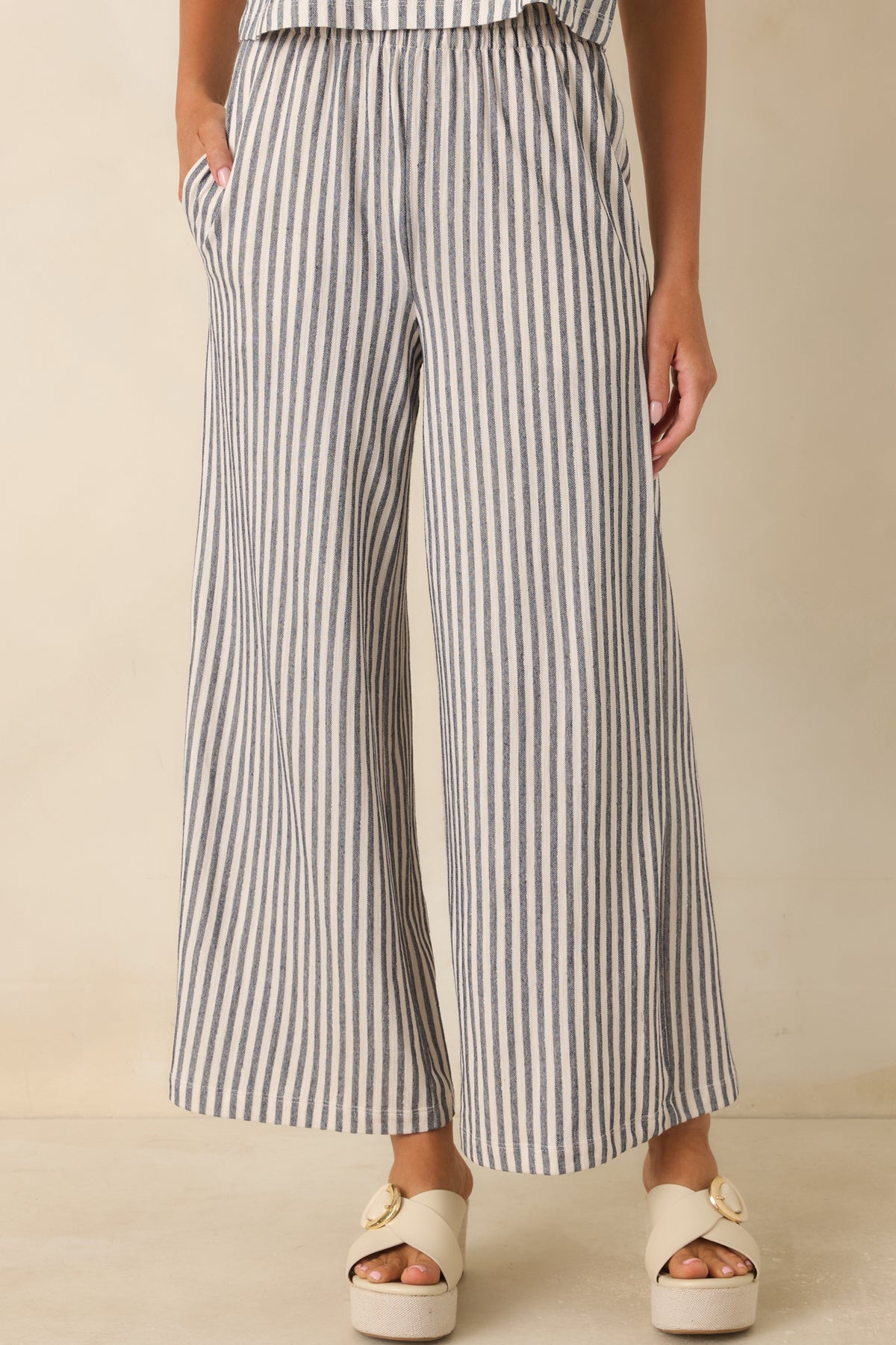 Close-up highlighting the soft cotton knit texture and timeless striped design of the pants.