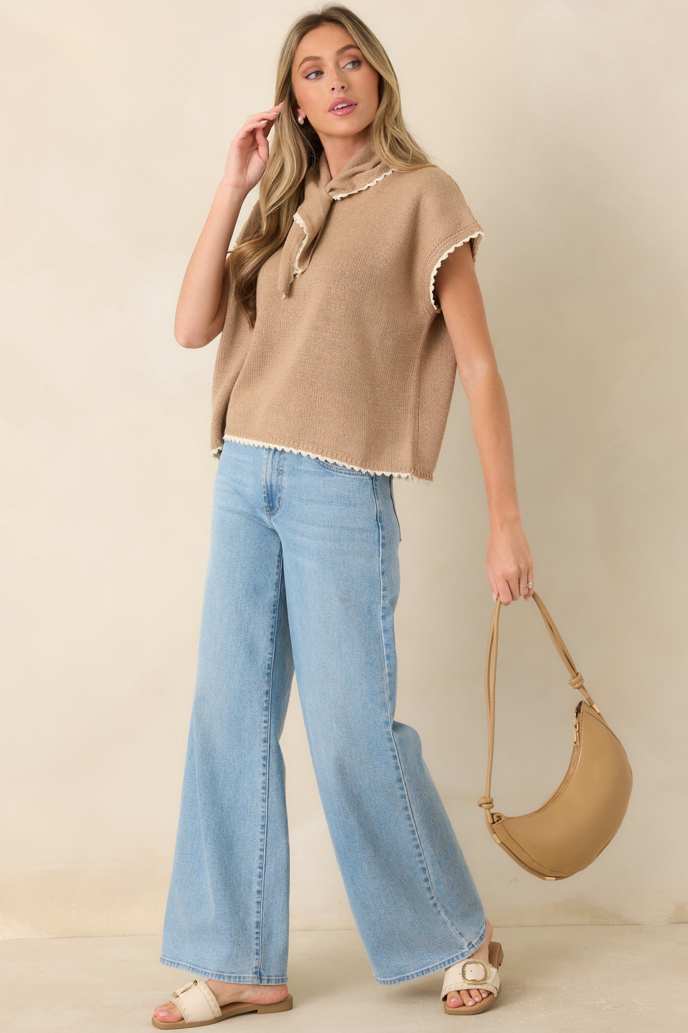 Cotton knit top featuring a built-in scarf neckline, ivory contrast trim, short sleeves, and a relaxed boxy silhouette.