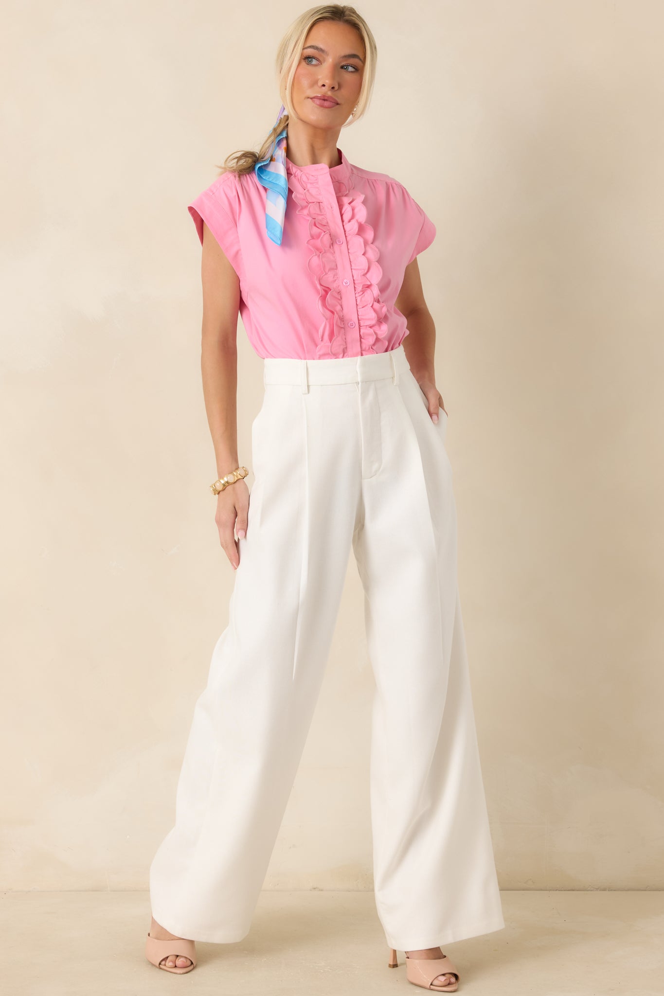 Cotton-linen blend pants in a cream hue featuring belt loops, side pockets, and a polished full-length finish.