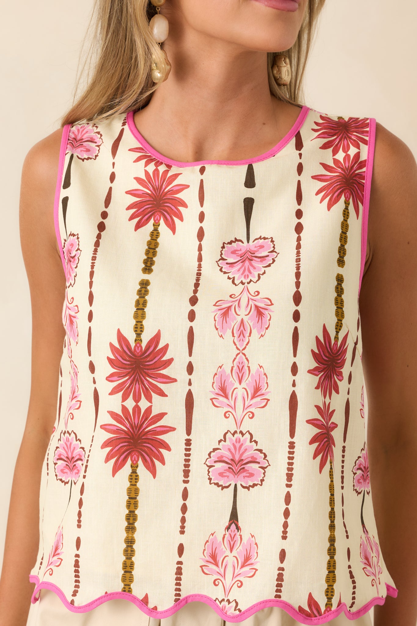 Soft cotton-linen fabric showcases a colorful floral print with a relaxed sleeveless silhouette.