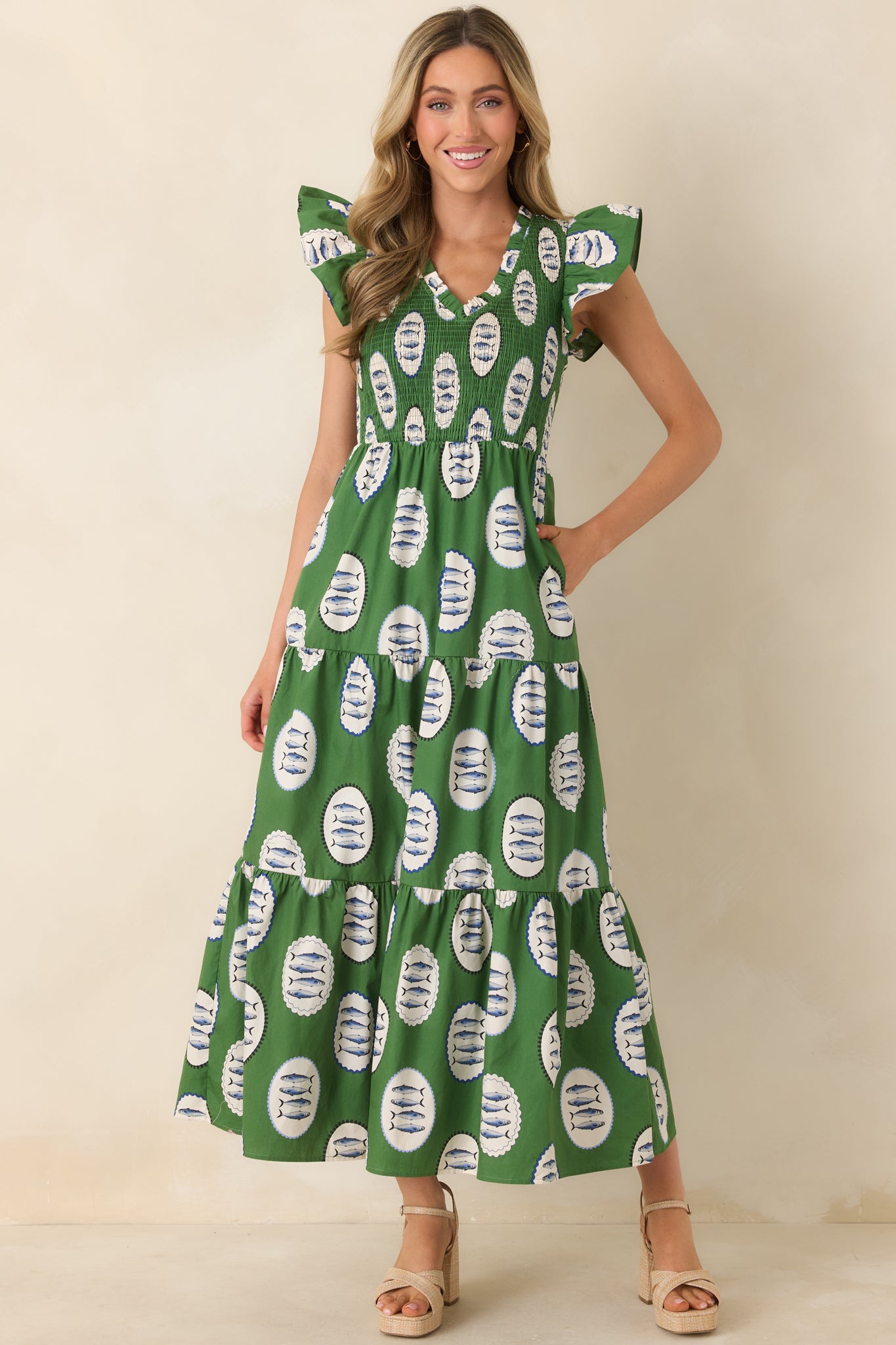 Cotton maxi dress featuring allover fish print, short sleeves, and a stretchy smocked bodice for a flattering fit