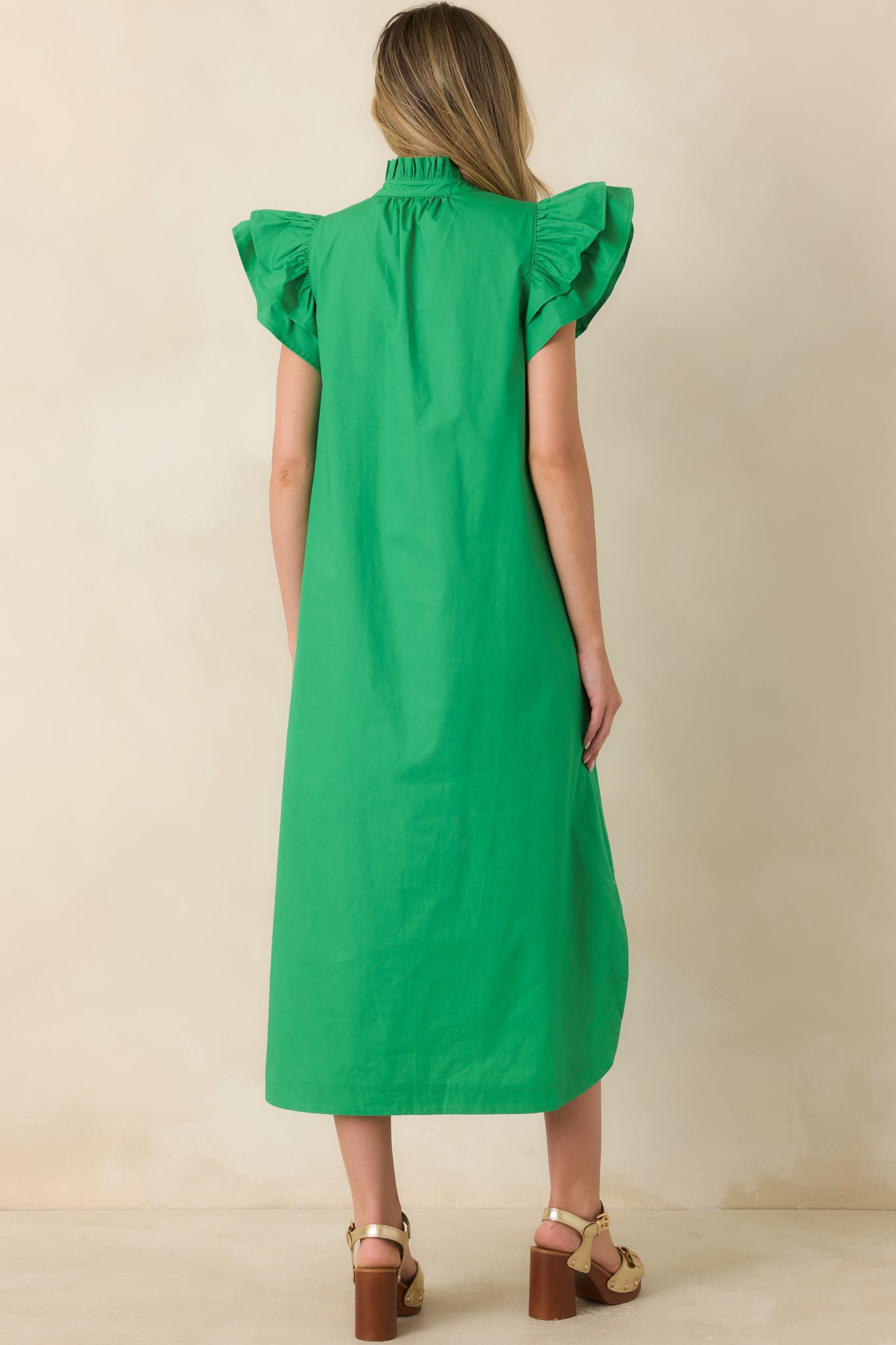 Back view of the cotton midi dress featuring a relaxed fit and curved hem.