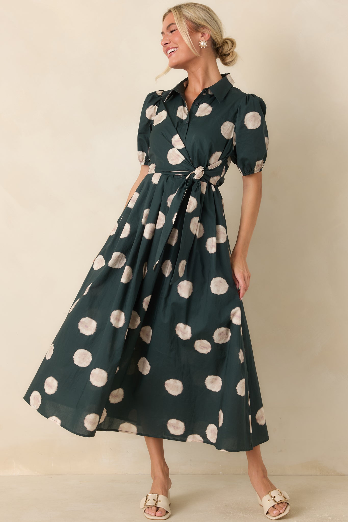 Breathable cotton midi dress showcasing elastic-cuff puff sleeves, side pockets, and a polished A-line shape.