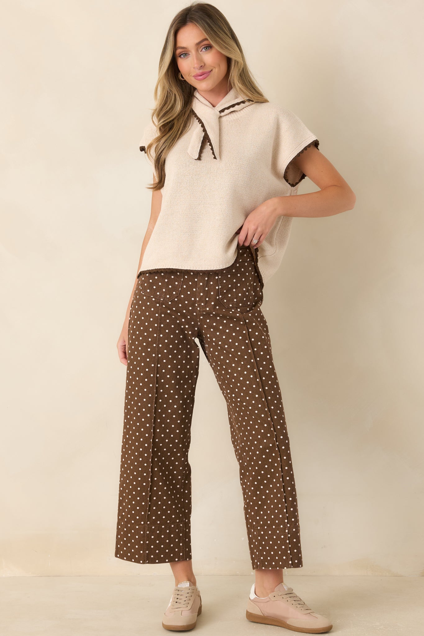 Cotton pants with defined front seams, belt loops, and a structured wide leg design.