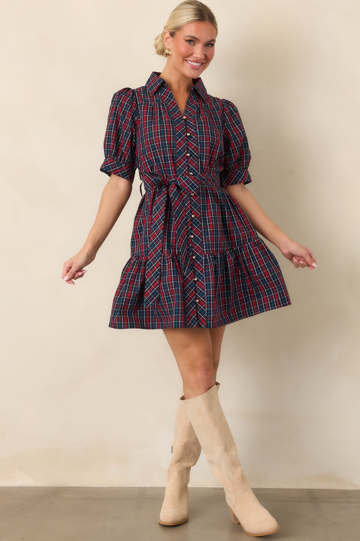 Cotton plaid mini dress featuring a relaxed bodice, softly gathered puff sleeves, removable matching belt, and tiered skirt.