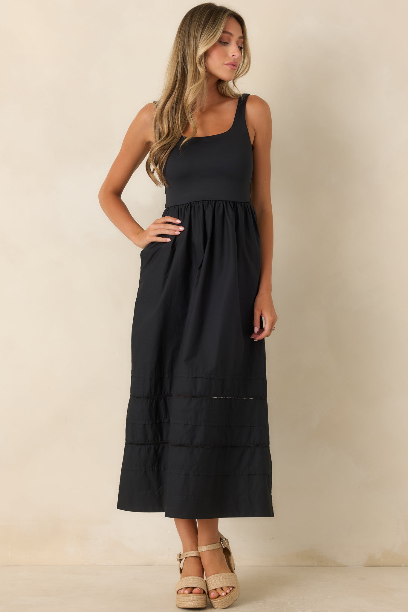 Cotton poplin midi dress with side pockets, a scoop neckline, and an elegant draped shape.