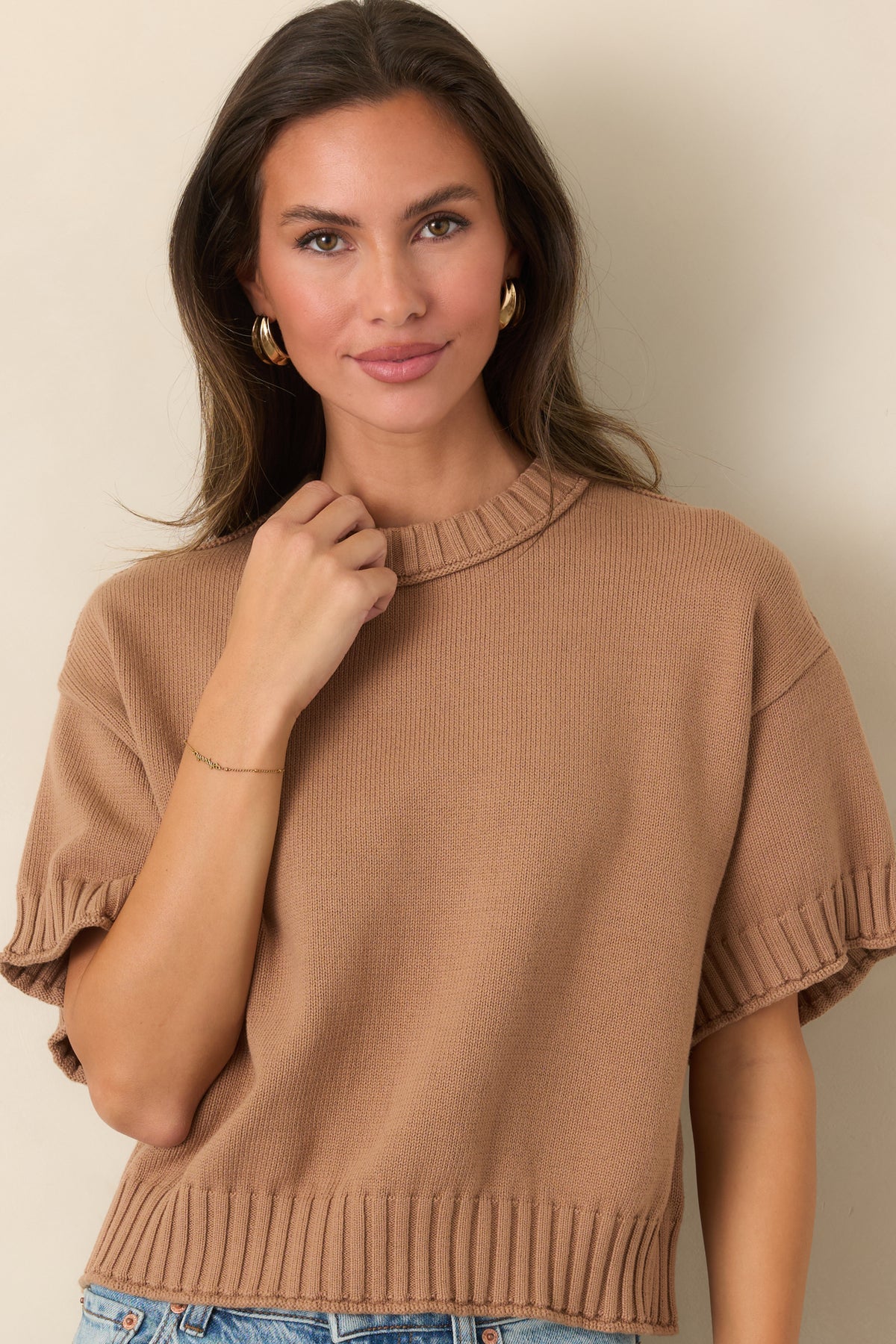 Relaxed cotton top showcasing its slightly boxy silhouette and chunky ribbed neckline.