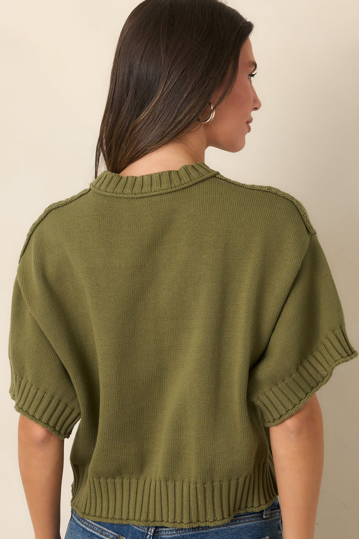 Rear of the 100% cotton top with a relaxed short-sleeve shape and ribbed hem.