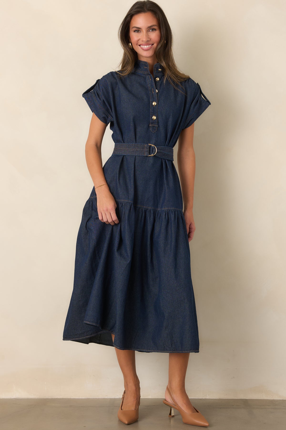 Cotton-rich dress featuring a stitched belt and flowing tiered skirt.
