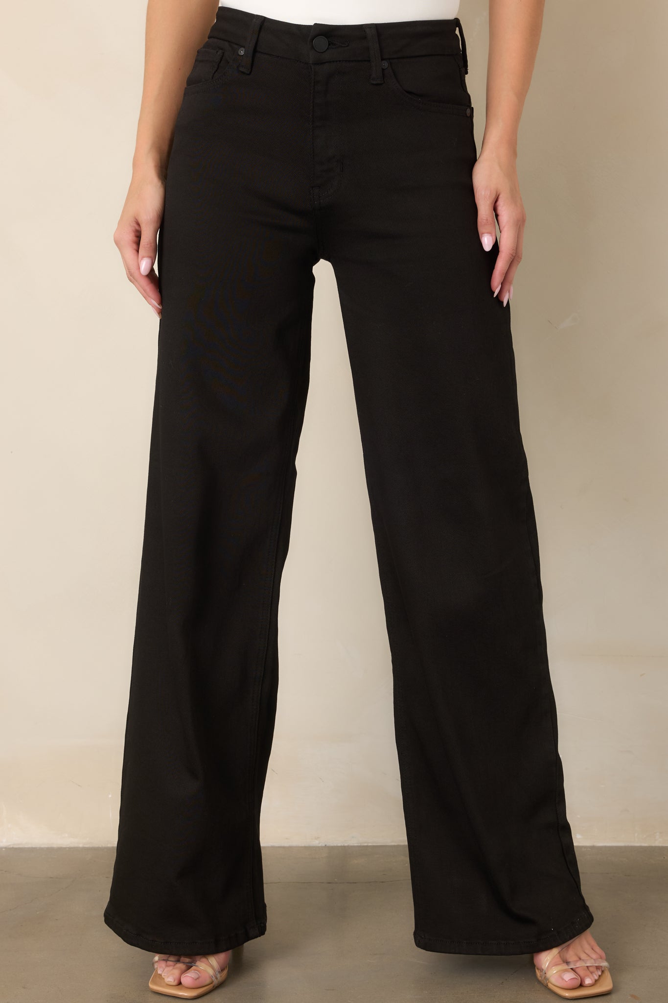 Detailed view of the cotton-rich denim fabric and wide-leg construction, highlighting the smooth finish and subtle stretch.