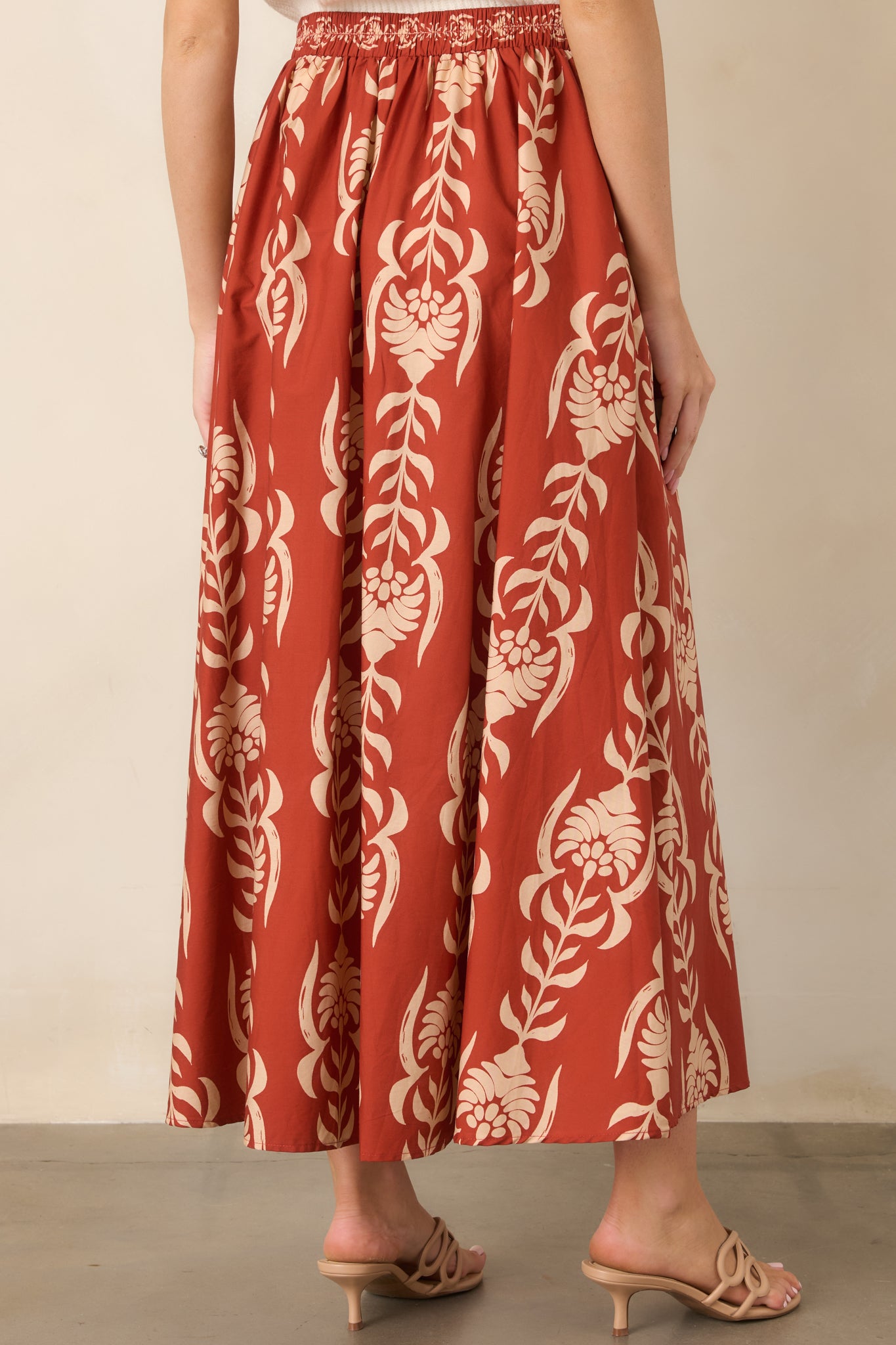 Rear view of the cotton skirt showcasing its elasticized back waistband and relaxed A-line silhouette.