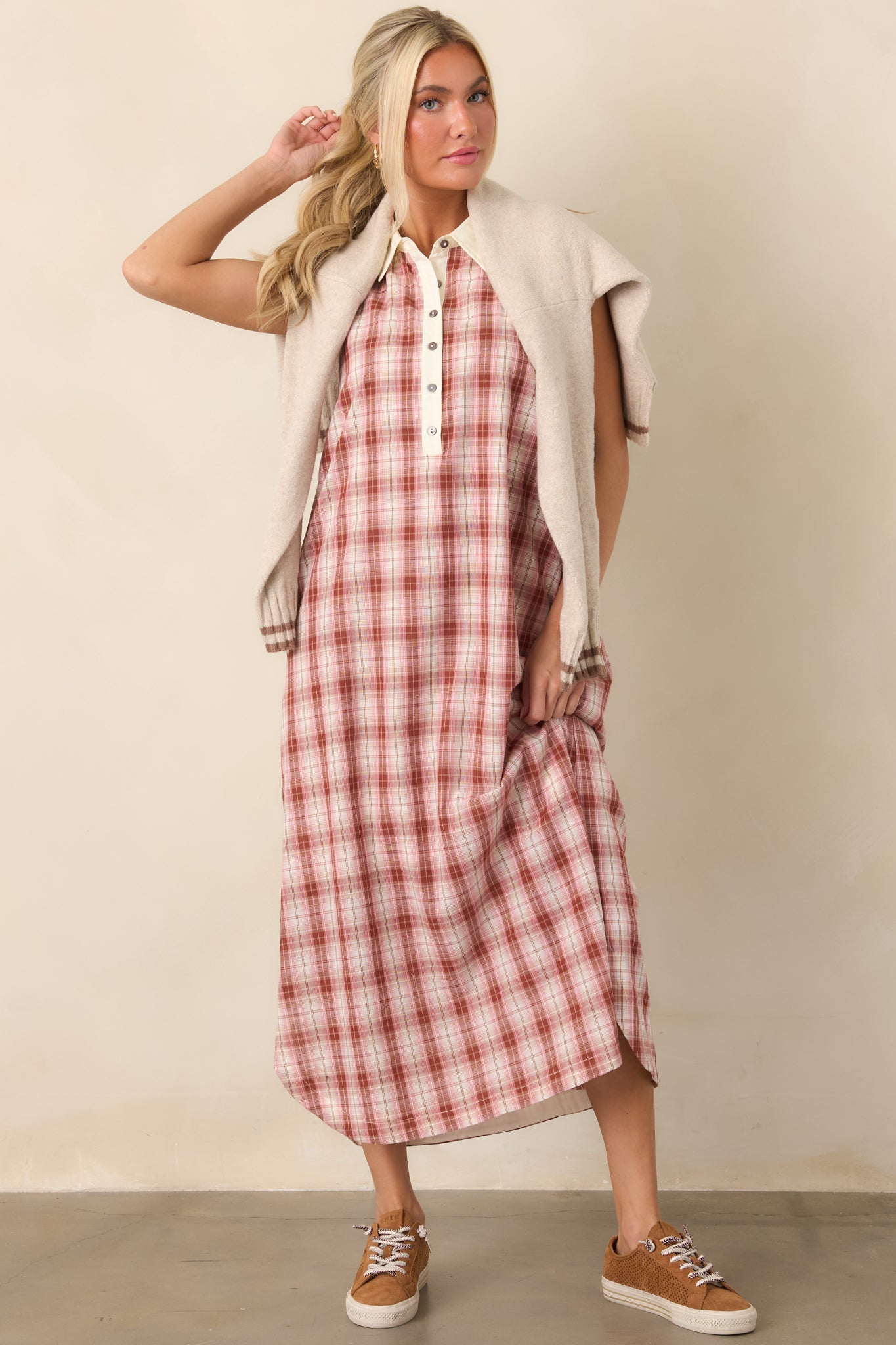 Breathable cotton dress featuring a sleeveless silhouette, crisp collared neckline, partial button-front placket, ivory trim, and relaxed fit.