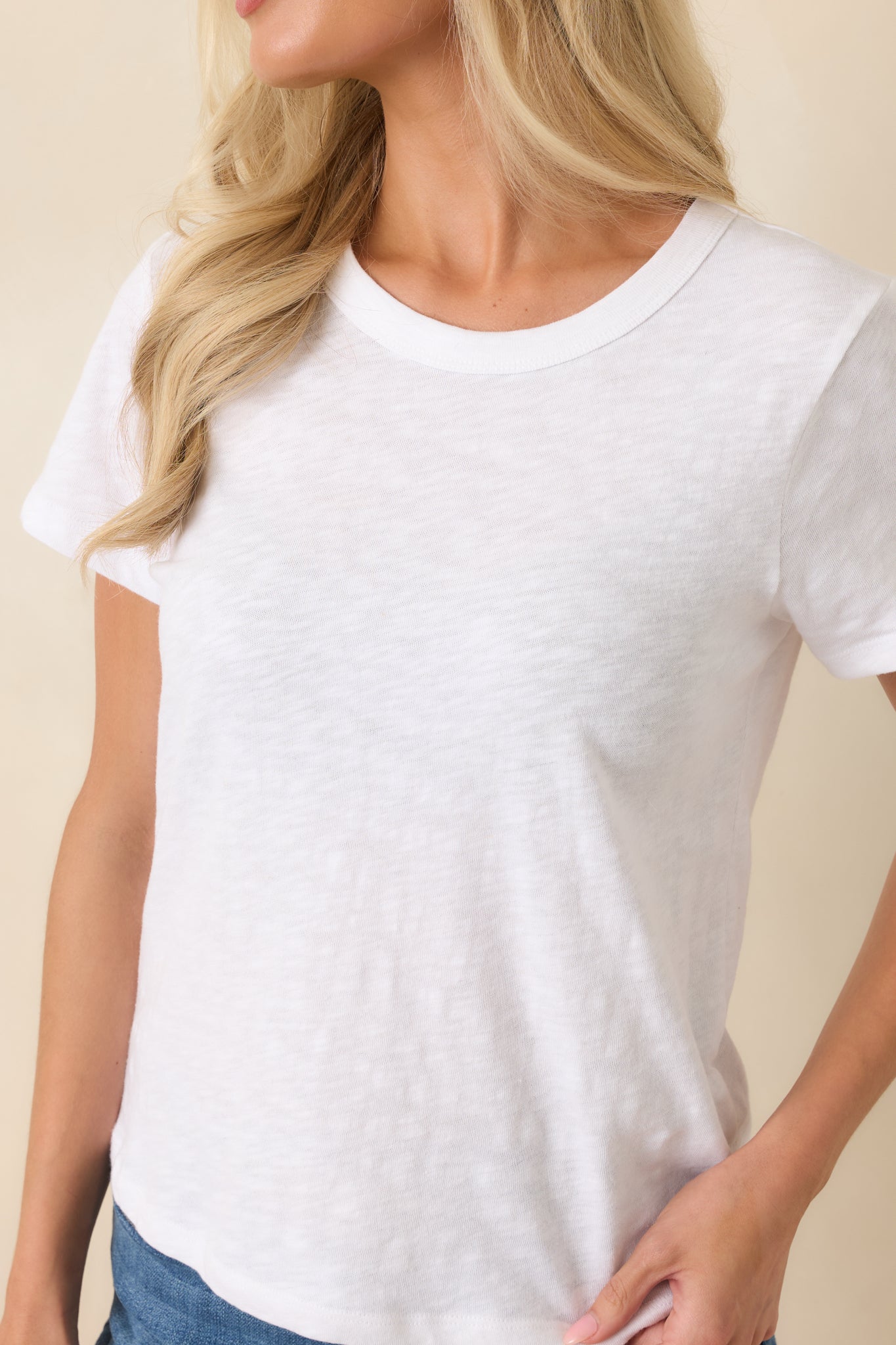 Close-up of the cotton slub knit texture, crew neckline, and soft fabric finish.