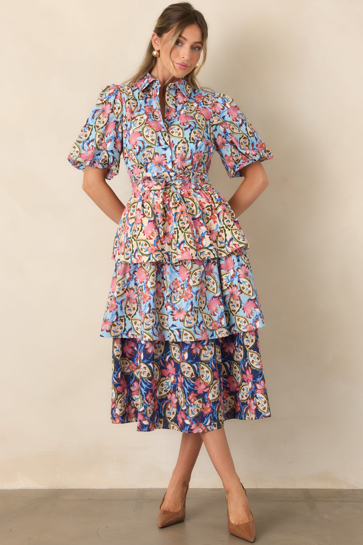 Cotton stretch dress with a pointed collar, short puff sleeves, defined waist, and tiered flowing skirt.