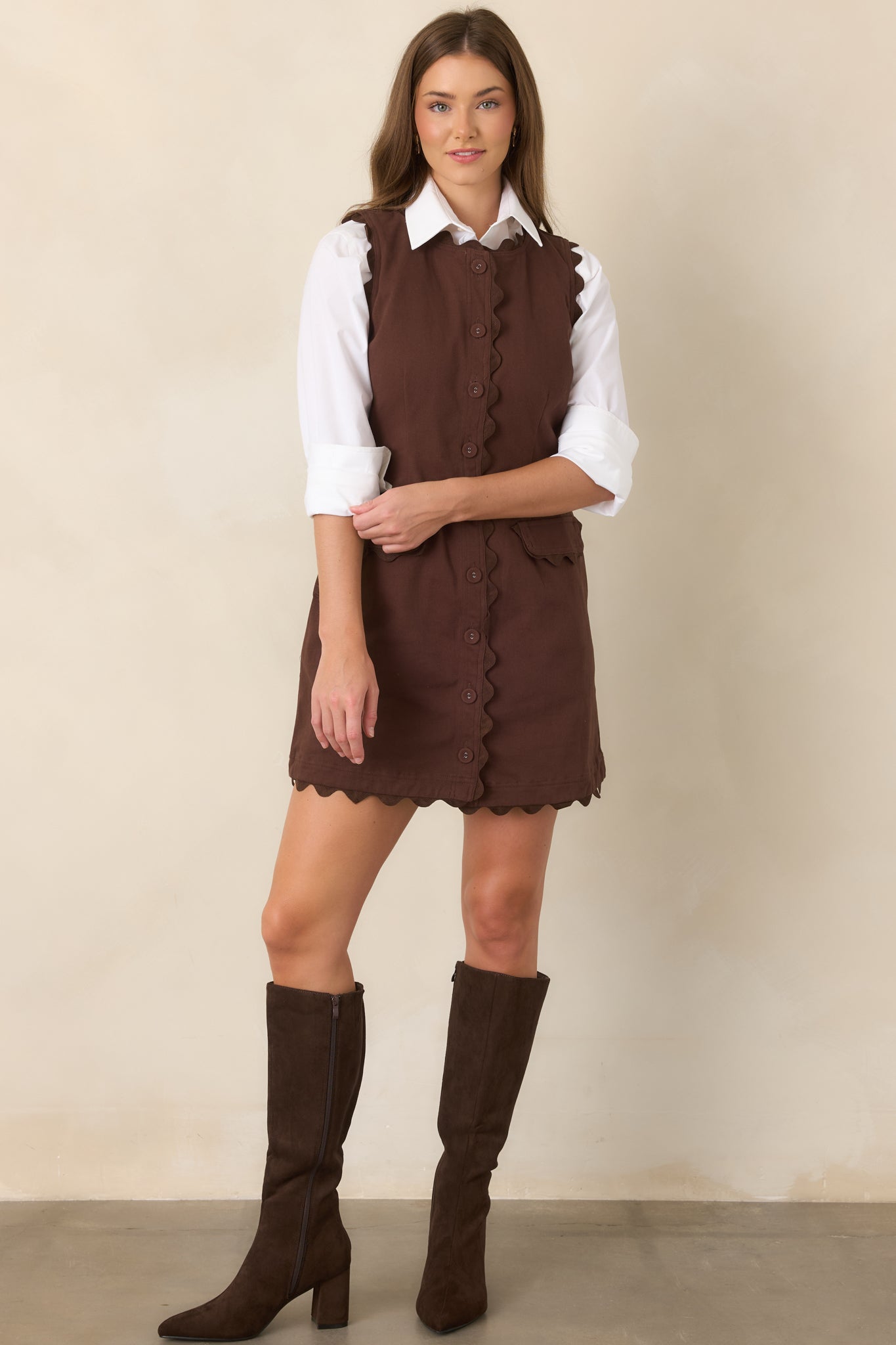 Cotton-rich stretch mini dress with tonal ric rac trim, covered buttons, flap pockets, and a softly shaped waist.
