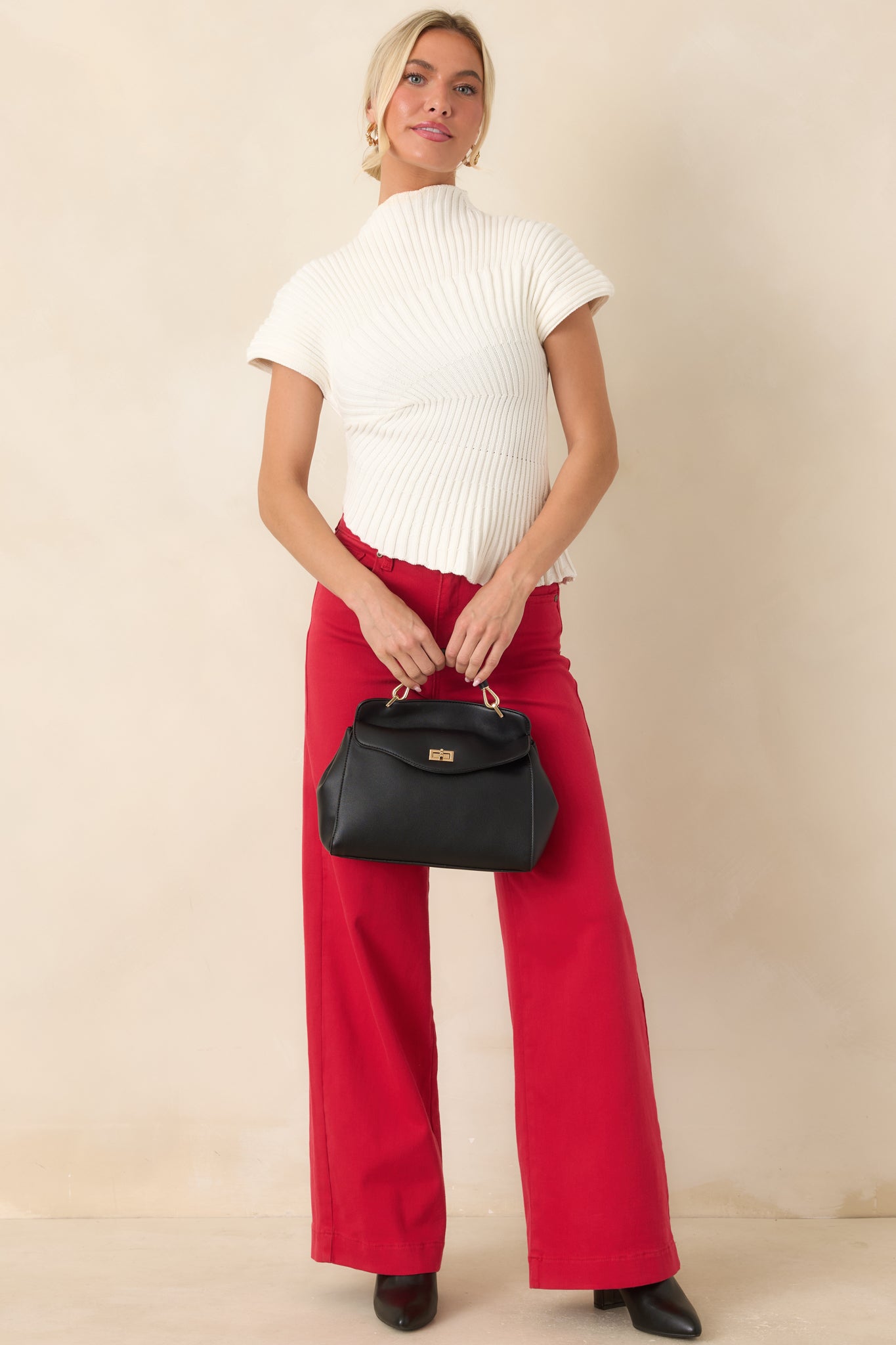 100% cotton top with an allover ribbed texture, body-skimming fit, and modern asymmetrical design.