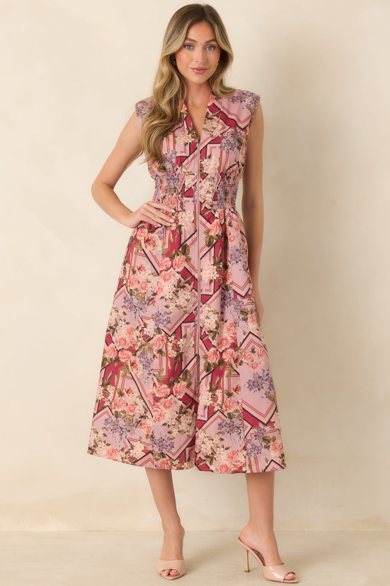 Flowy cotton midi dress with a structured V-neckline, full front zip closure, elastic smocked waist, and practical side pockets.